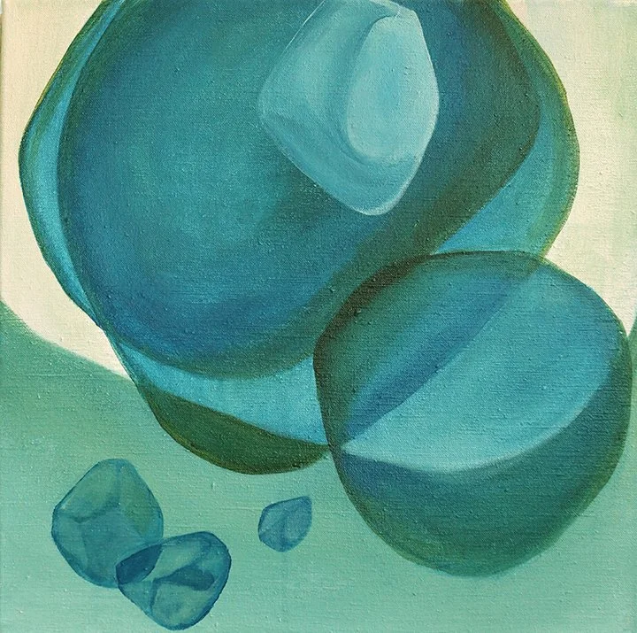 Abstract painting of various blue and teal-colored geometric shapes and stones on a light green background.