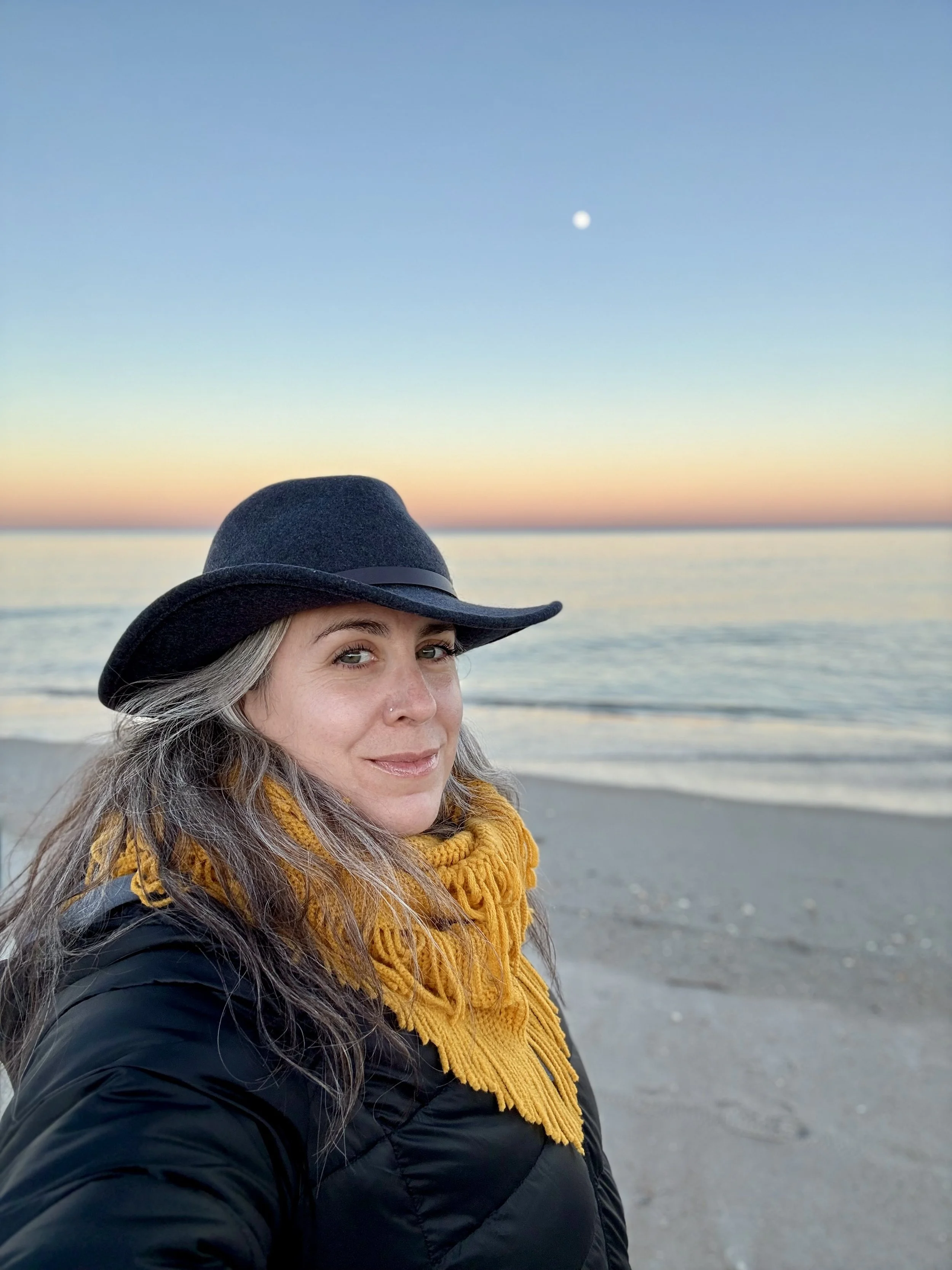Portrait of the artist on the beach at sunset