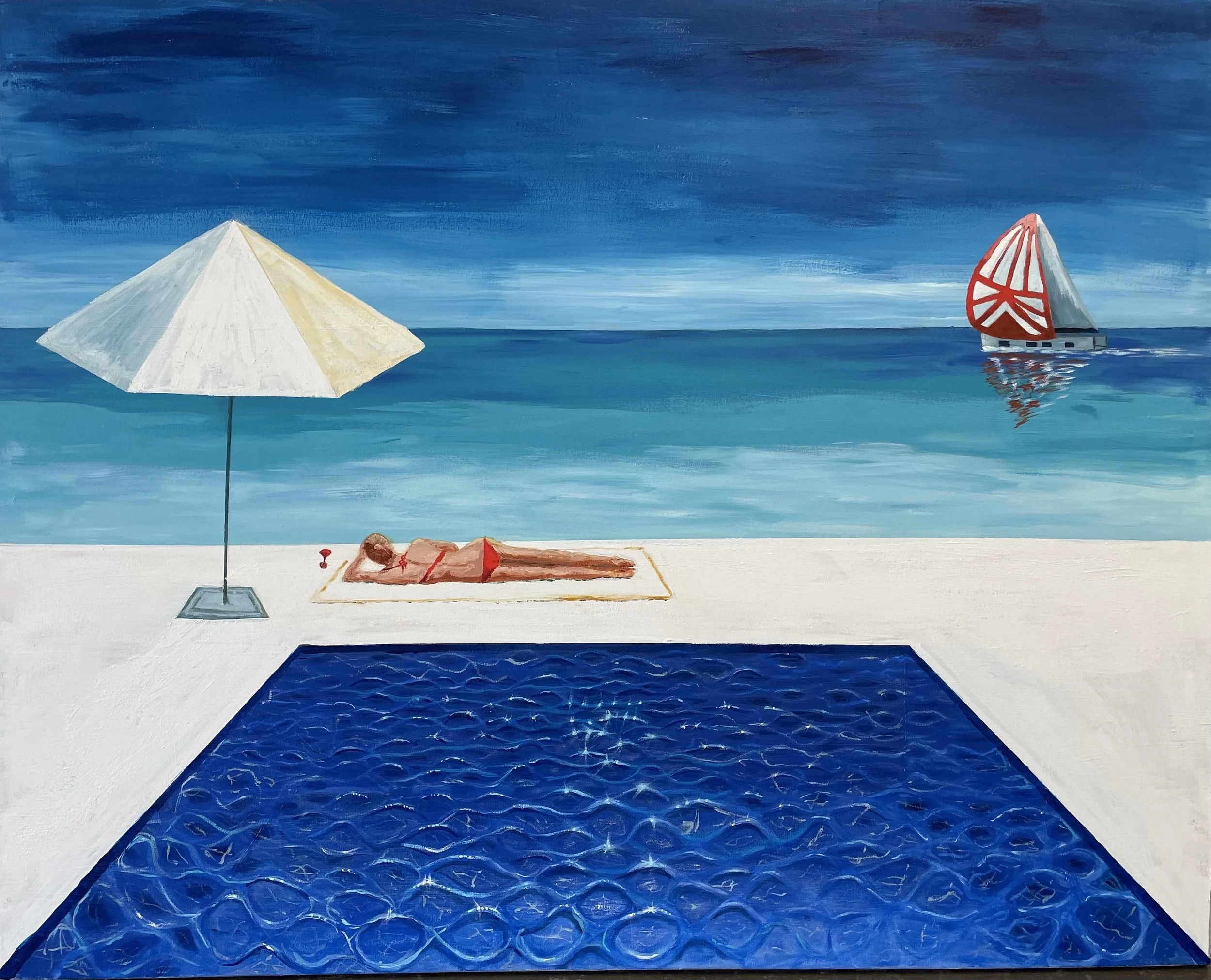 Woman  in orange bikini lying by sun umbrella and sparkling blue swimming pool. Looking at a sailboat on the blue ocean. Under a cloudless sky.