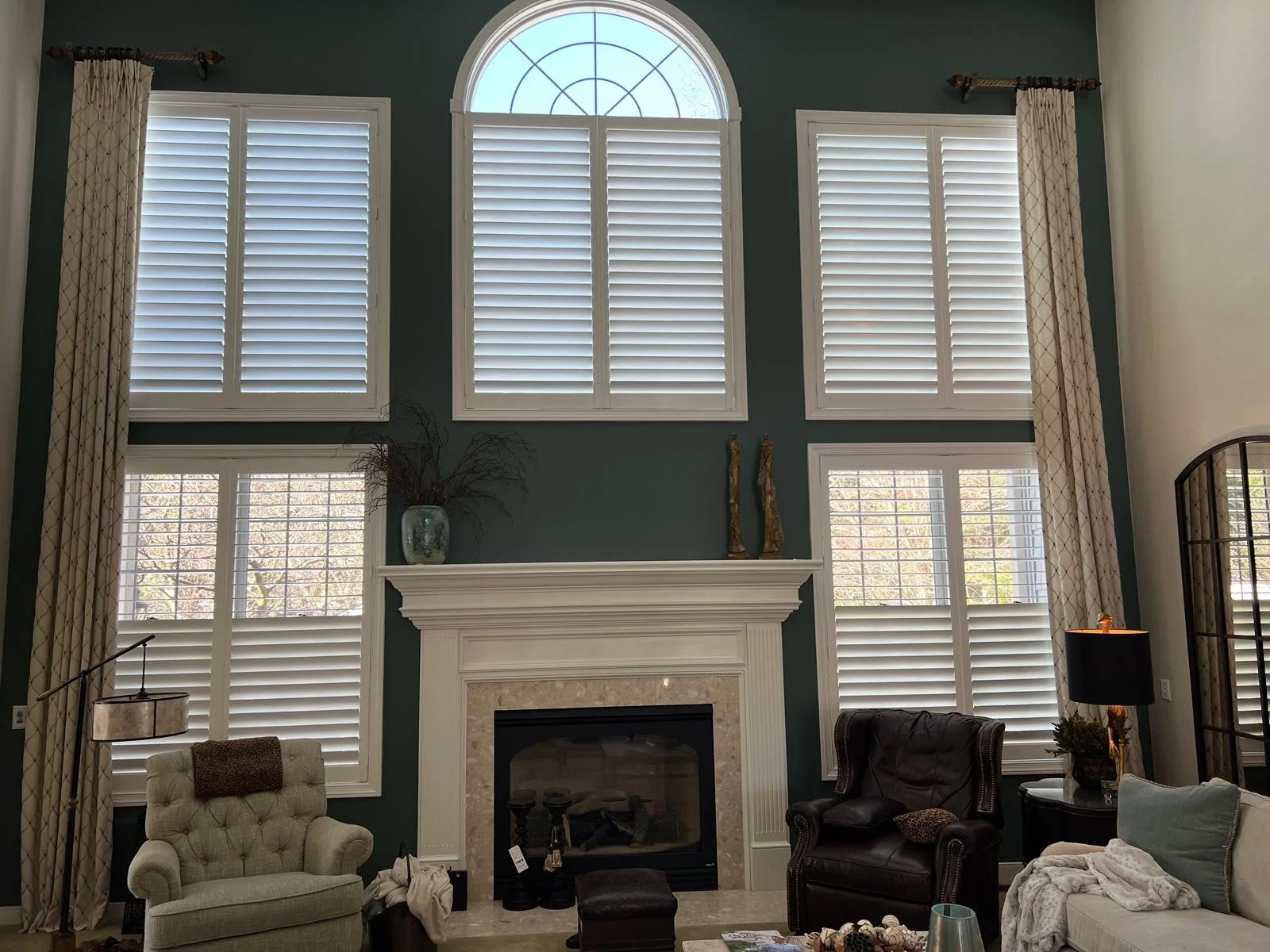 Plantation shutters on large living room windows, Cleveland Ohio — Rose Custom Window Treatments