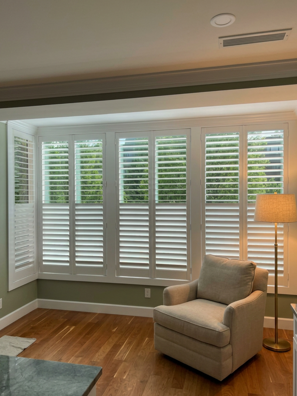 Interior room with custom-fitted plantation shutters installed by Rose CWT in Ohio