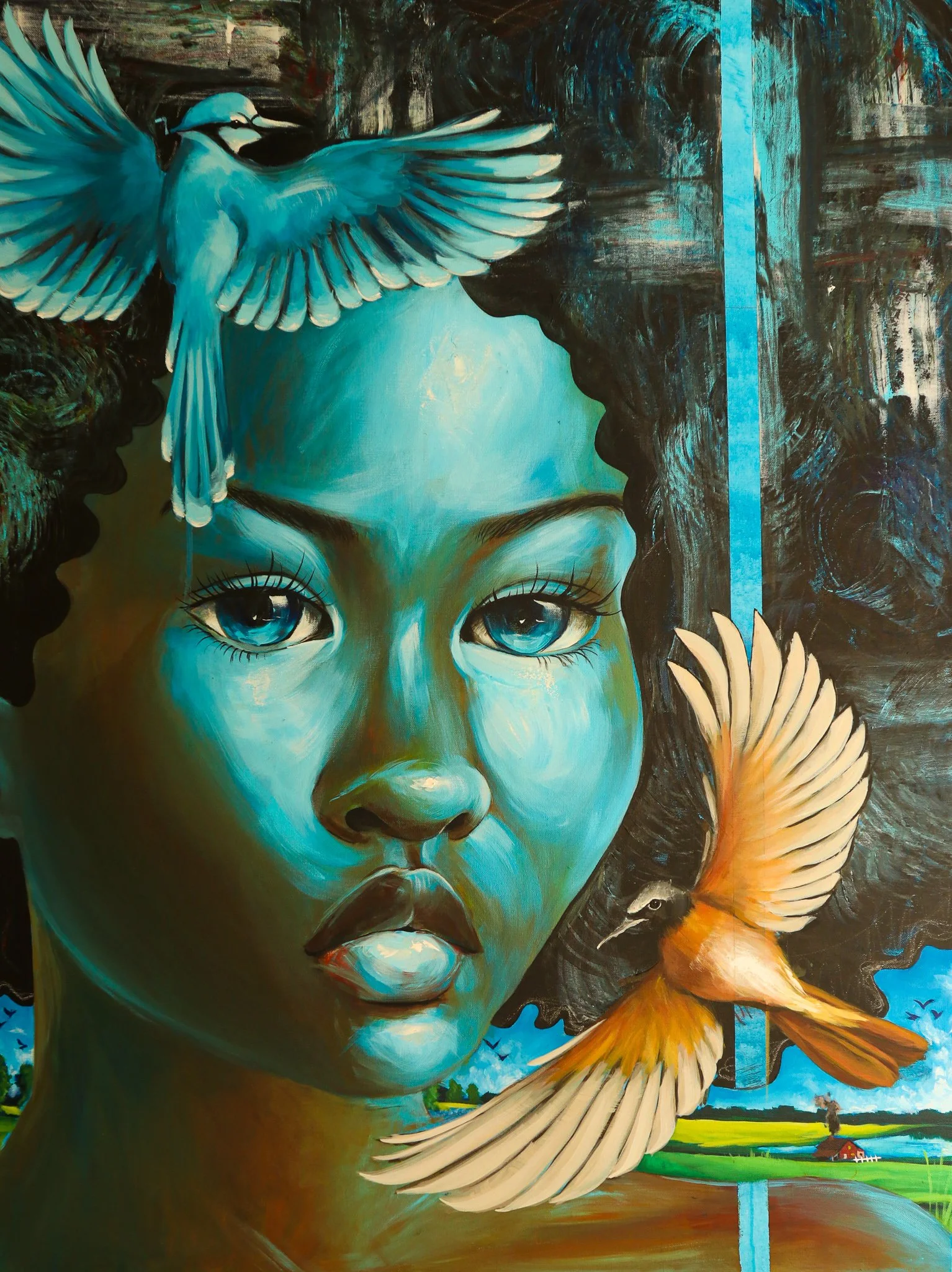 A vivid painting of a young girl with blue eyes and blue-toned skin. A blue bird with outstretched wings is perched on her forehead, and a yellow bird with wings spread wide appears next to her face. The background features a stylized landscape with 