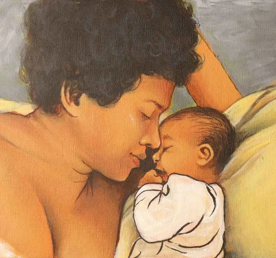 A man and a newborn baby cuddling closely, with their foreheads touching, in a warm and intimate moment.