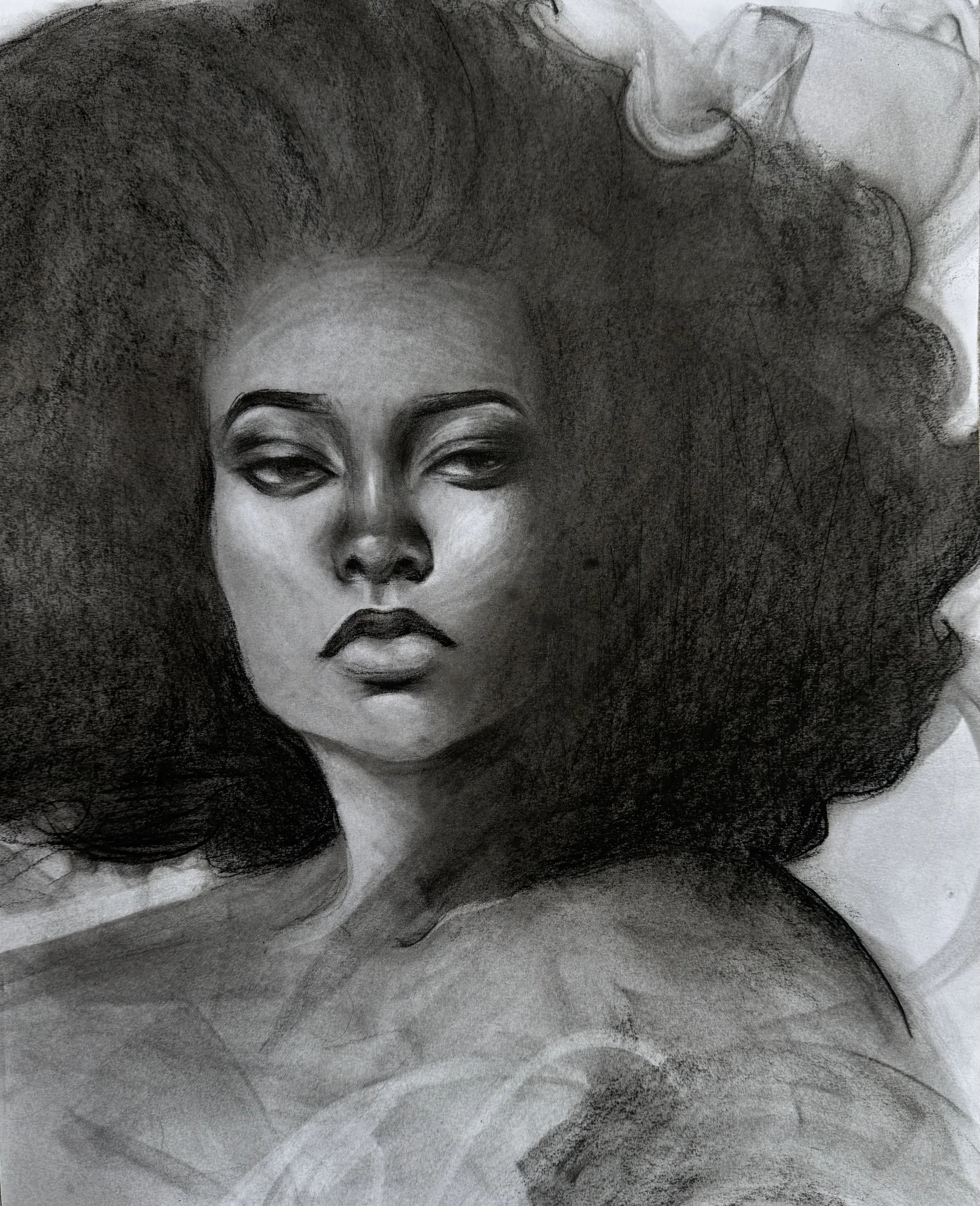 A black and white portrait sketch of a woman with closed eyes, full lips, and voluminous hair.