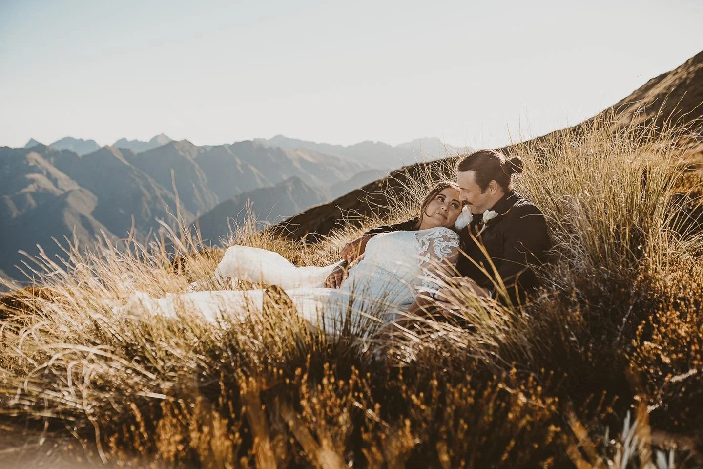 Bride and groom helicopter mountain portrait 