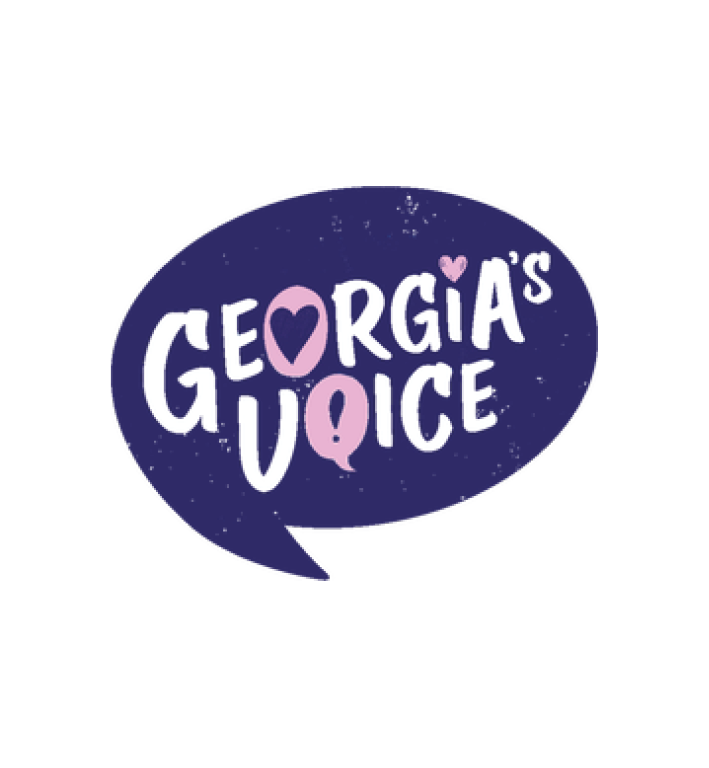 Logo with dark purple background and white and pink text that reads 'Georgia's Voice' with hearts and speech marks integrated into the letters.