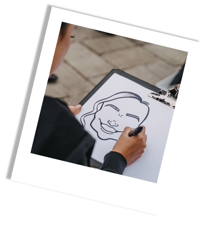 Person drawing a smiling woman's face on a clipboard with a black marker.