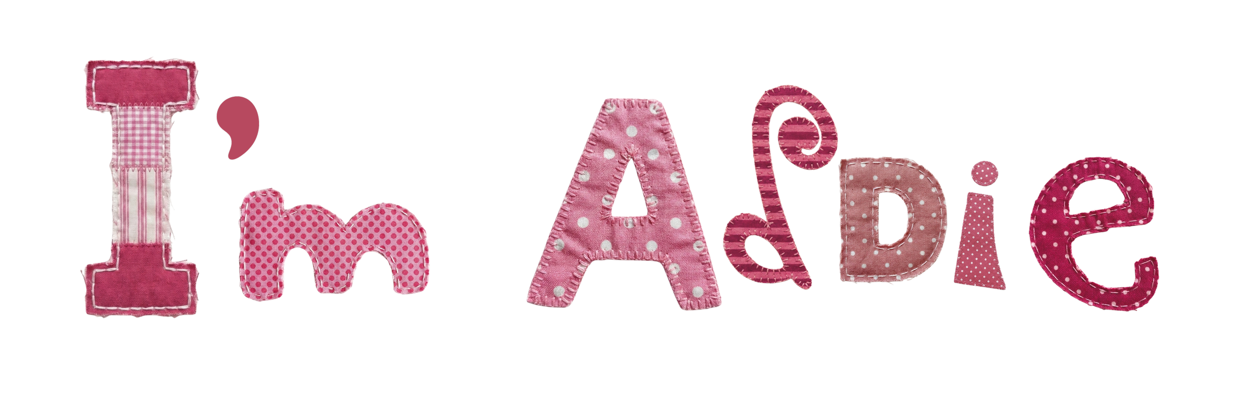 Decorative fabric letters spelling 'I' 'm' 'A' 'd' 'a' 'e' in pink and white patterns.