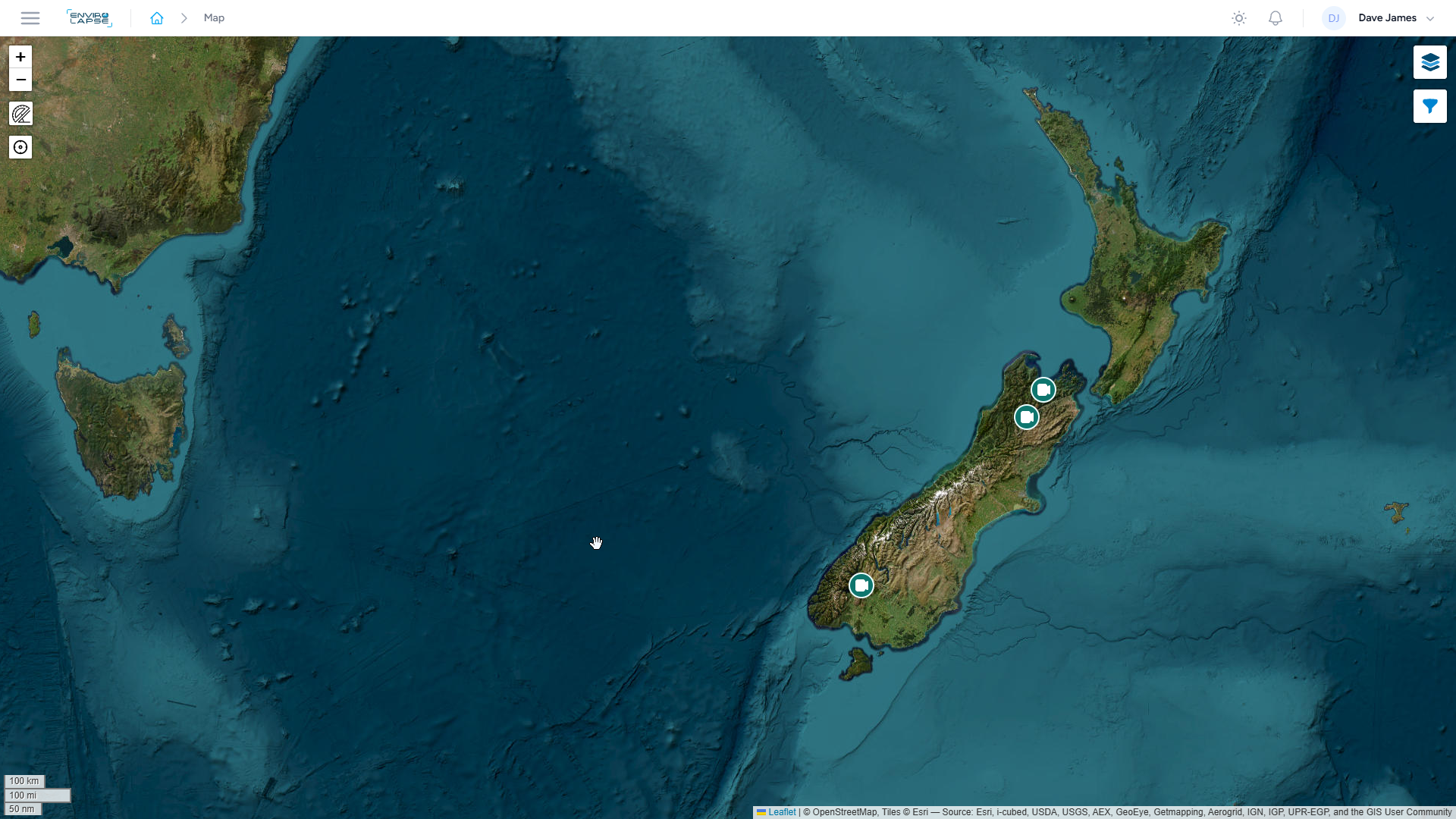 Map showing New Zealand in the South Pacific Ocean, with surrounding ocean and parts of Australia visible to the west. The map includes features such as terrain and water depth, with some icons indicating camera points.