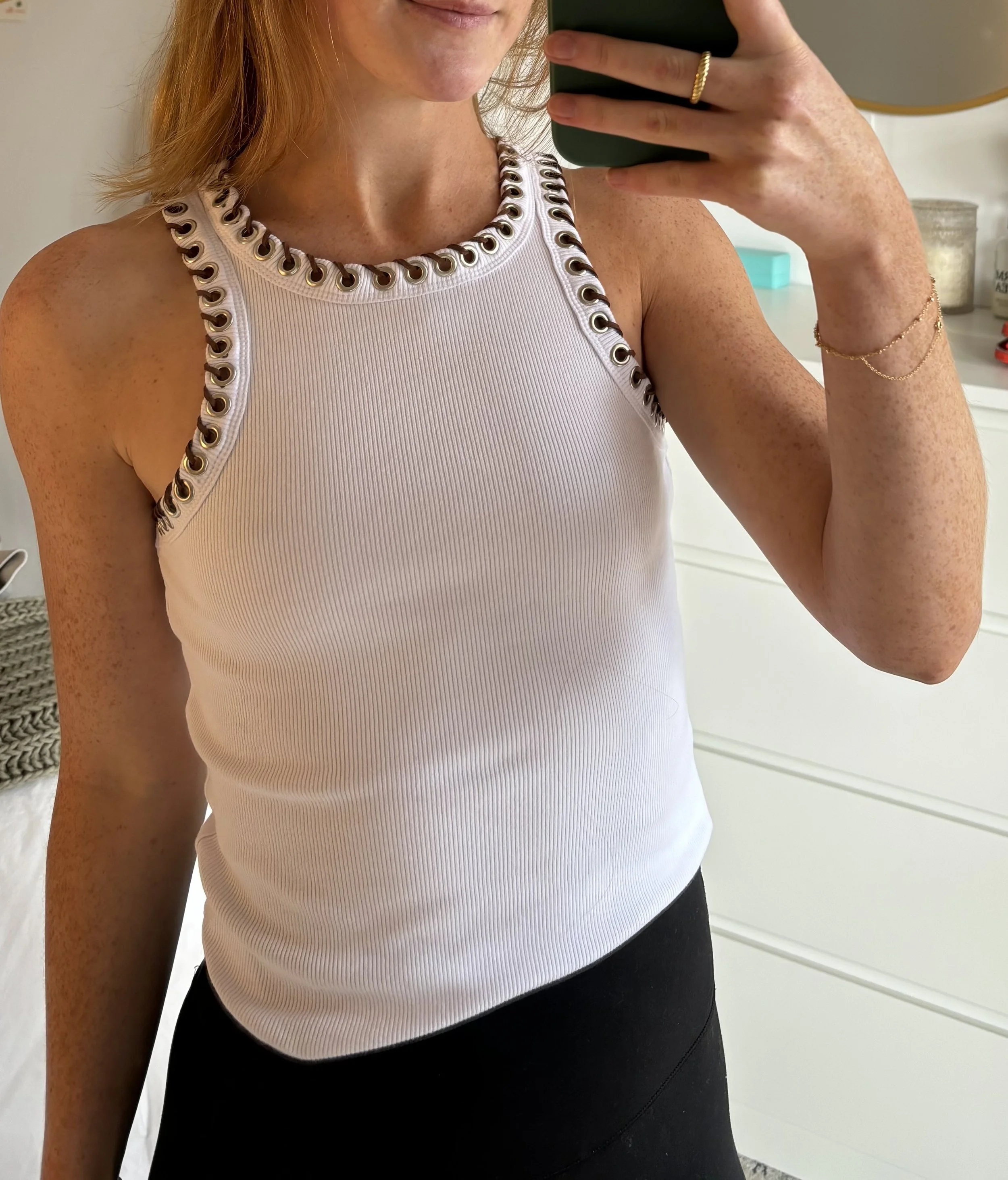 DIY grommet and suede rope detail on top neck and arm holes 
