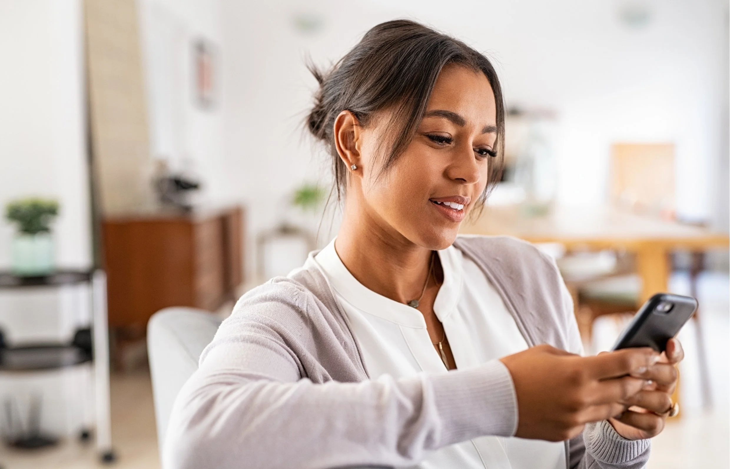 Woman booking a nutritionist consultation on her phone