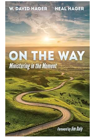 Book cover titled 'On the Way: Ministering in the Moment' by W. David Hager and Neal Hager, with foreword by Jim Daly. Features a scenic landscape with a winding road through green hills and a sunrise or sunset sky.
