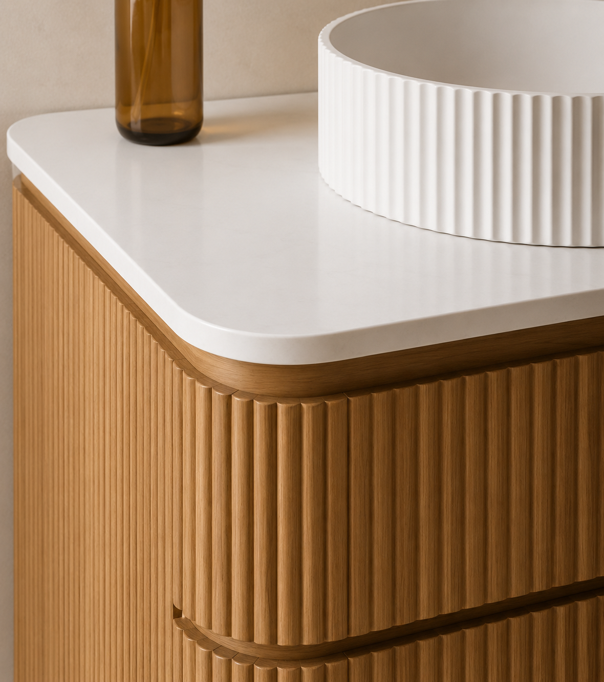 Close-up of a modern wooden cabinet with a white rounded edge top, a tall amber glass vase, and a white ridged decorative bowl.