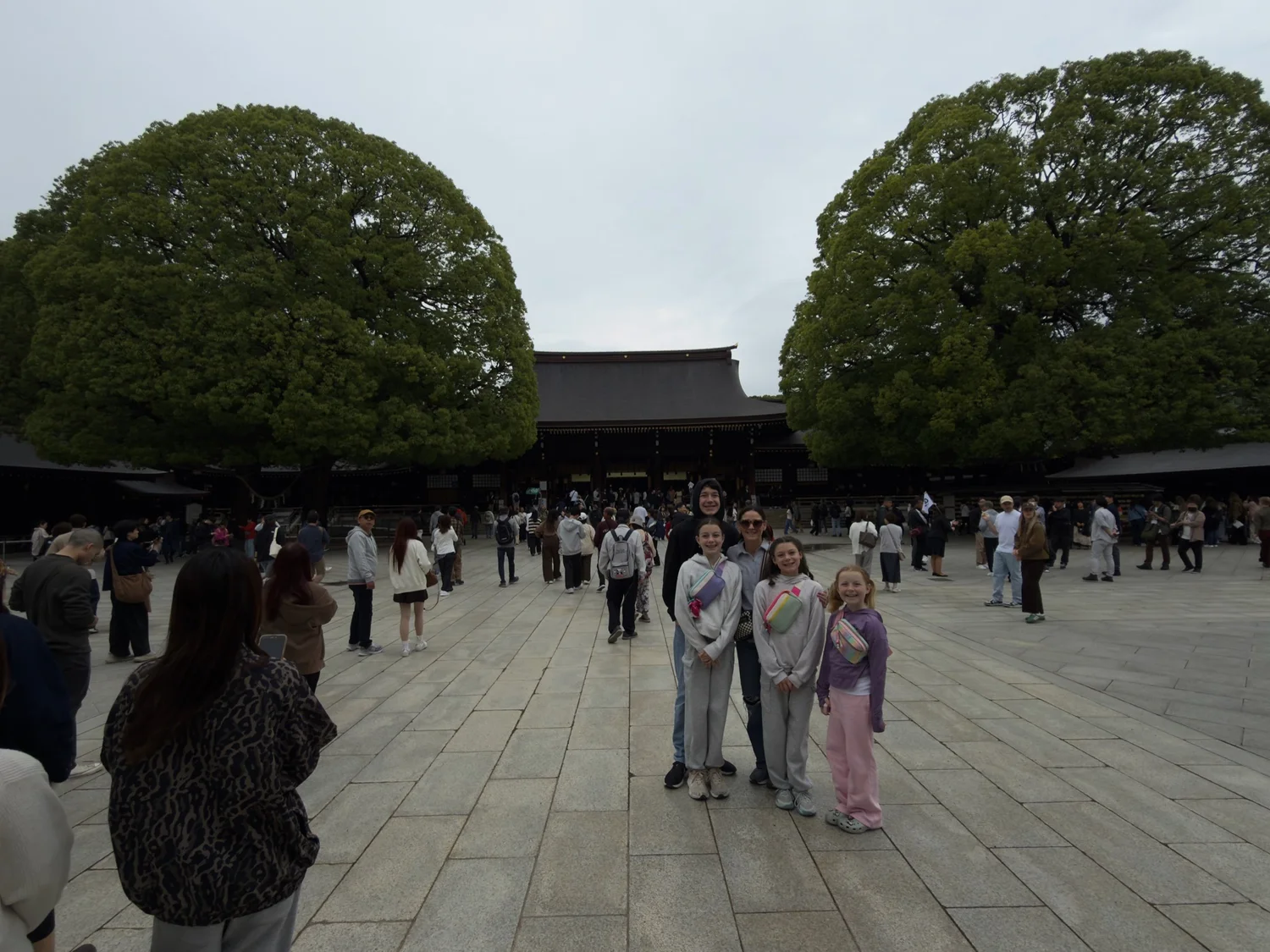 Our family walking through Meiji Shrine in Tokyo