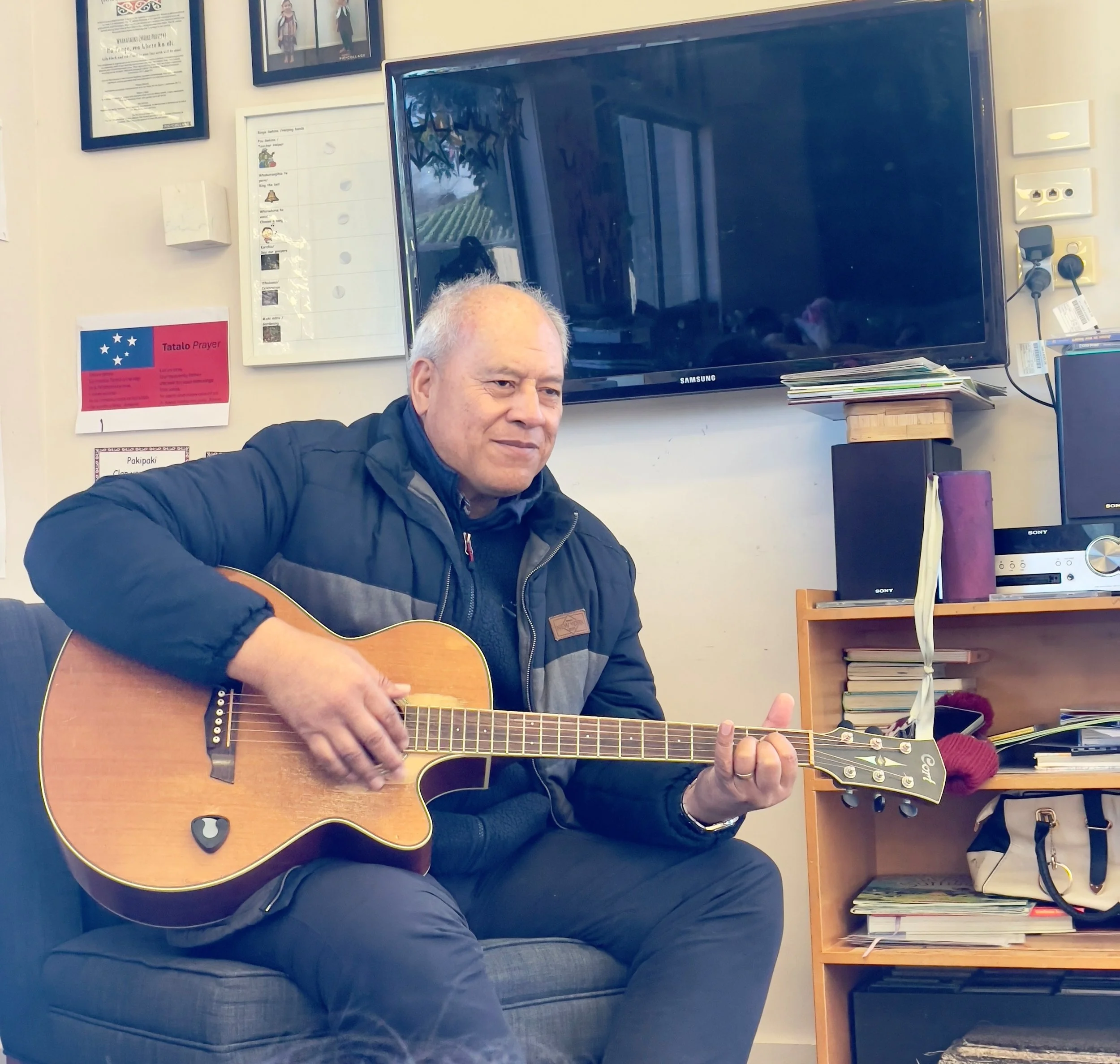 Pastor Keleva sing with the children