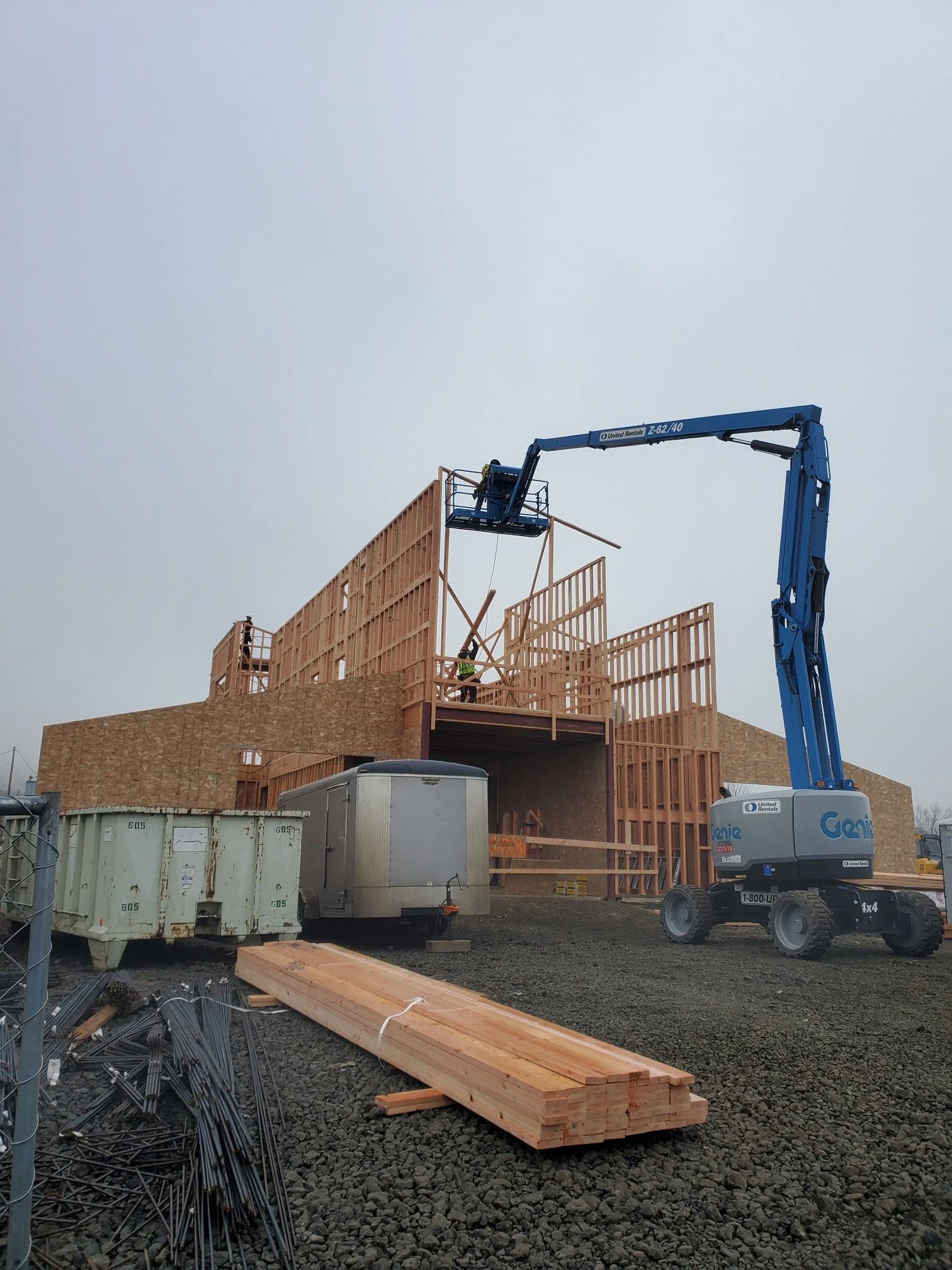Commercial building construction with structural framing and boom lift installation.jpg