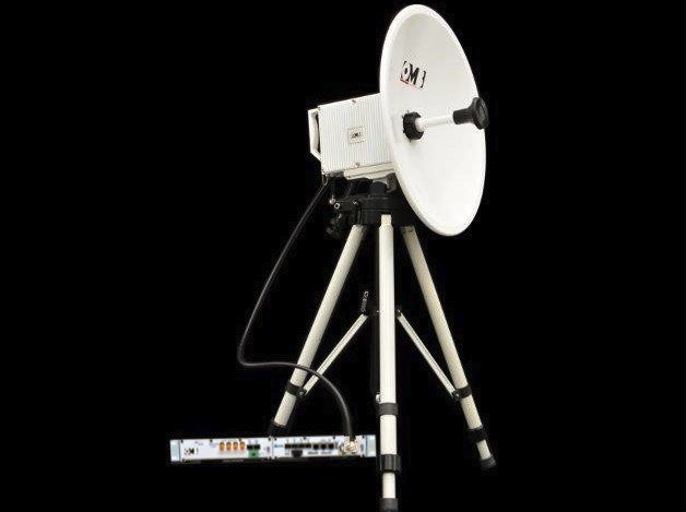Satellite dish antenna setup with supporting tripod and electronic equipment against black background.