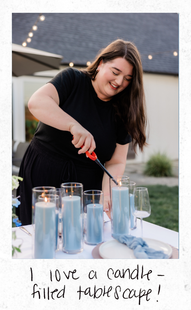 A woman lighting candles on a decorated table outdoors, with a note saying, 'I love a candle-filled tablescape!'