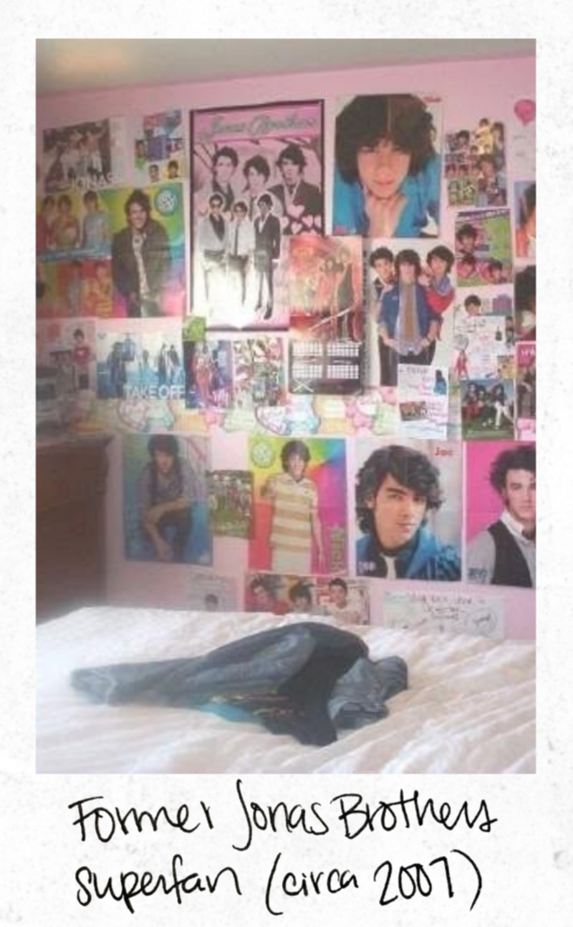 A bedroom wall decorated with posters of the Jonas Brothers and other pop stars, with a bed in front and some clothes laid on it, and handwritten notes at the bottom reading 'Former Jonas Brothers superfan (circa 2007).'