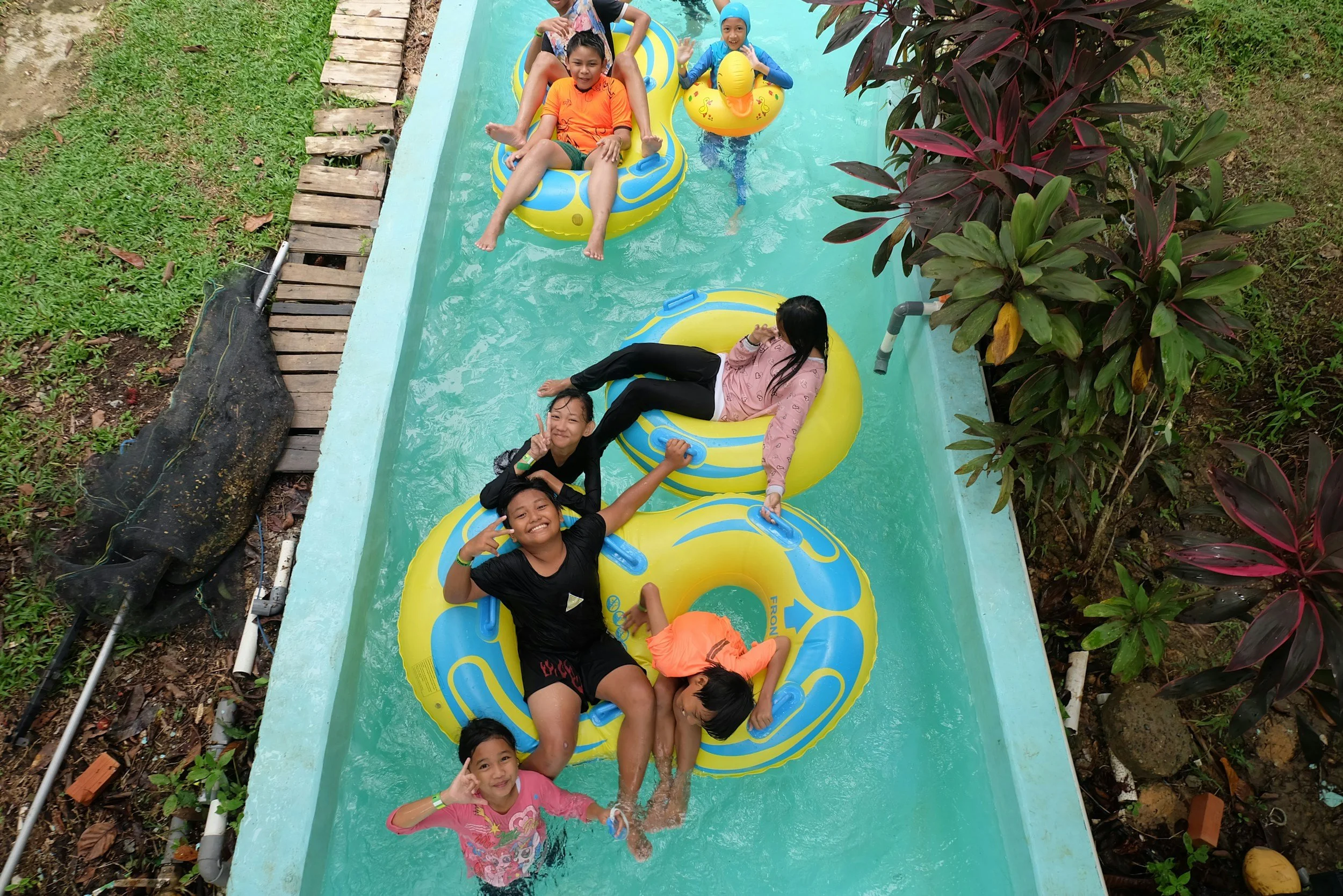 kids and family on a lazy river