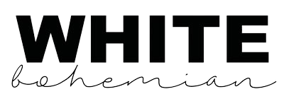 Close-up of white handwritten text on black background, reading 'WHITE' in bold uppercase and cursive style.