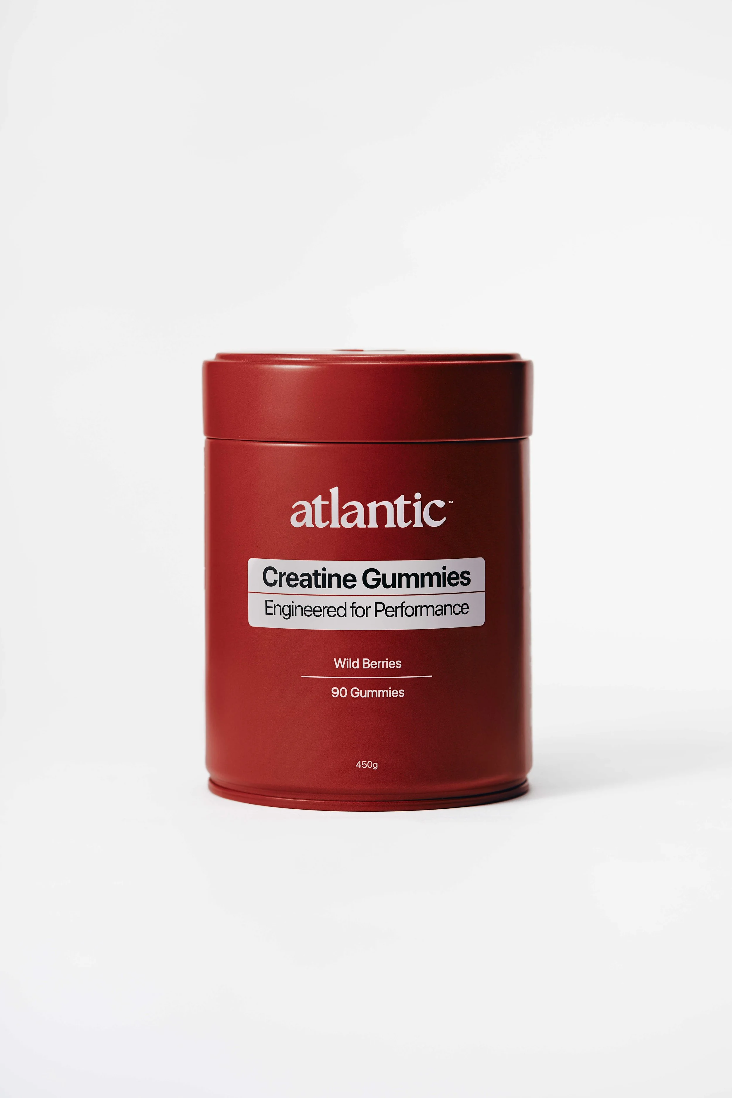 Red container of Atlantic Creatine Gummies with a white label, white text, and a red lid.