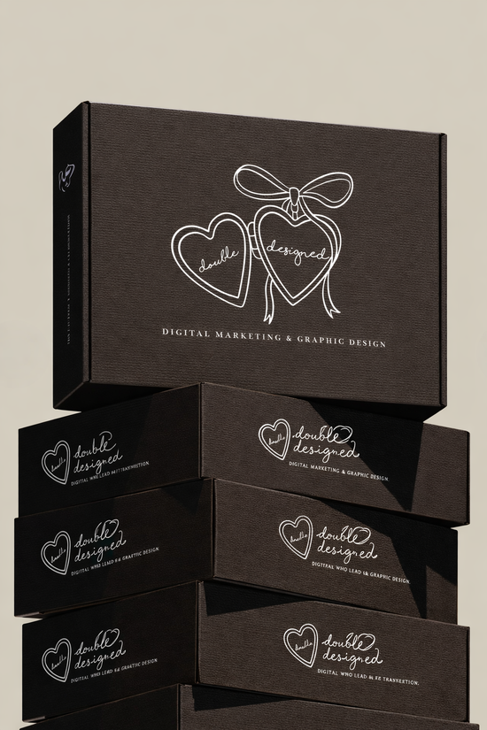 Stack of black boxes with white handwritten-style text and graphics, one on top of the others, advertising digital marketing and graphic design services.