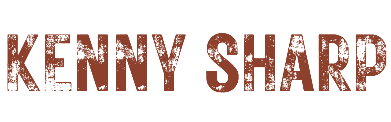 Distressed brown text reading 'KENNY SHARP' on a black background.