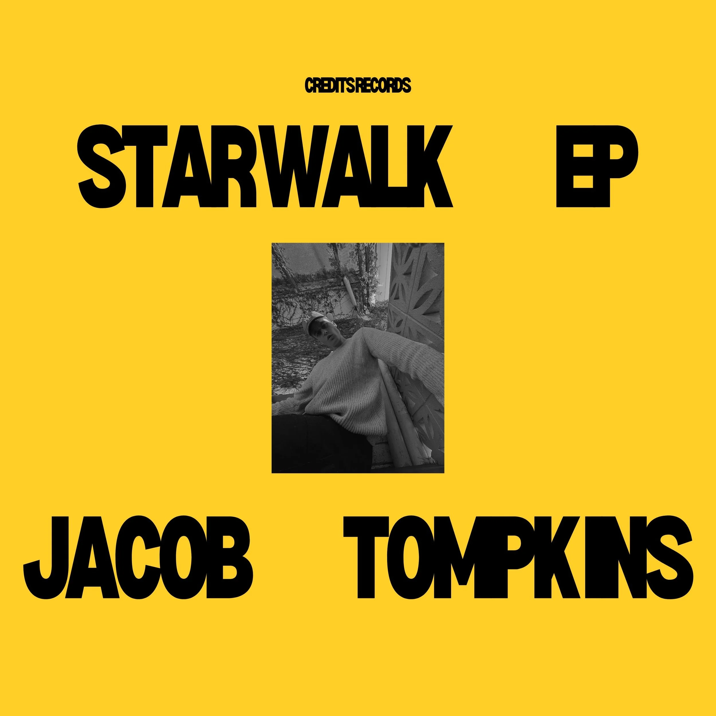 Yellow background with large black text reading 'STARWALK' and 'JACOB TOMLIN' in the foreground, with smaller black text above reading 'CREDITS RECORDS' and a small black question mark icon.
