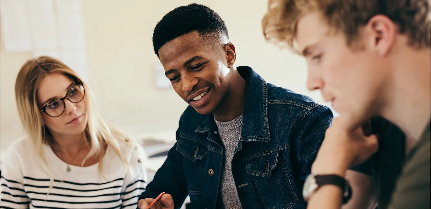 Students of Directions to Diploma having a discussion in a classroom (hero image)