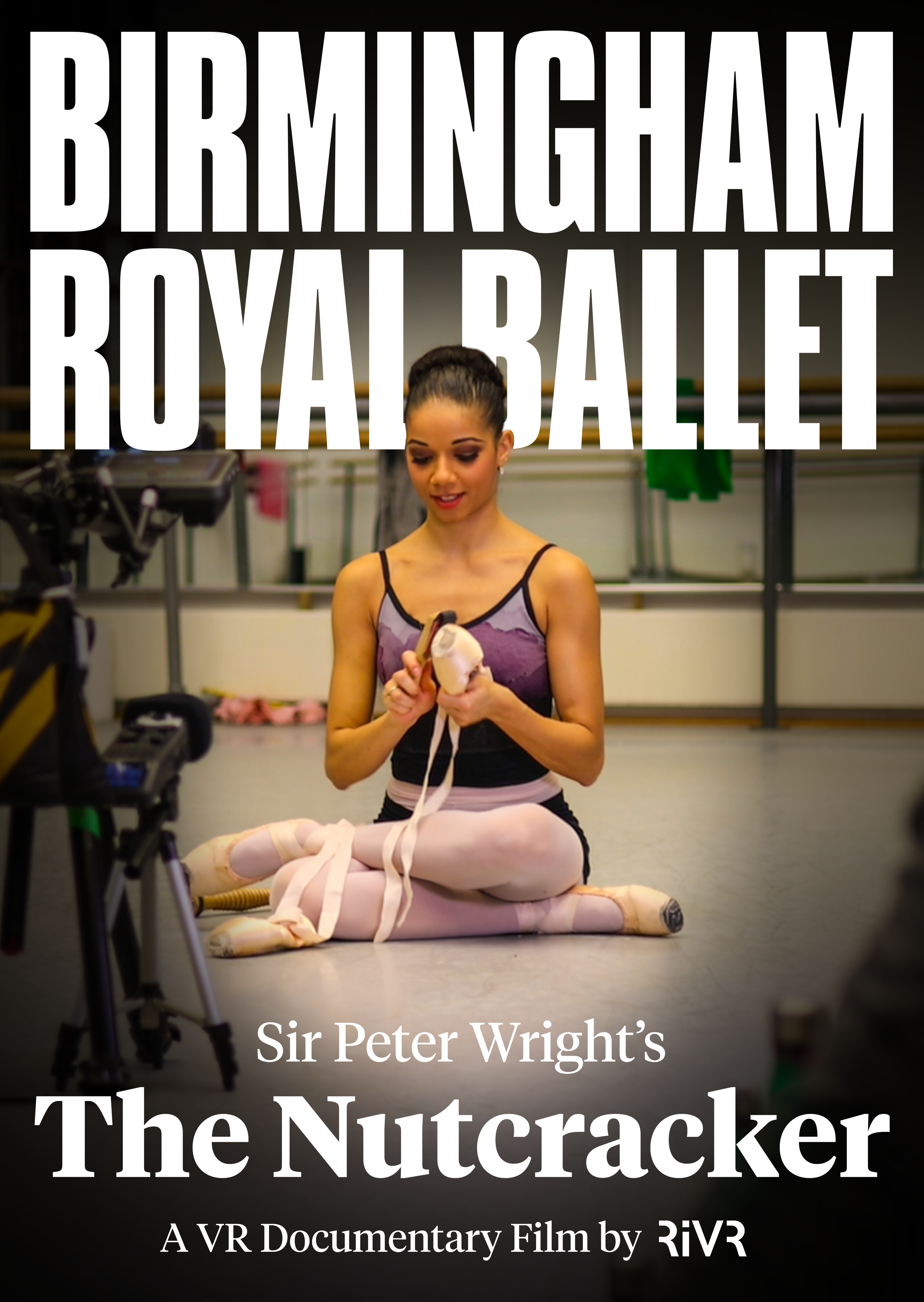 A woman in a ballet costume seated on the floor, holding ballet slippers, surrounded by filming equipment, in a studio or rehearsal space, with ballet costumes hanging in the background. Overlaid text promotes "Sir Peter Wright's The Nutcracker," a VR documentary film by RiVR.