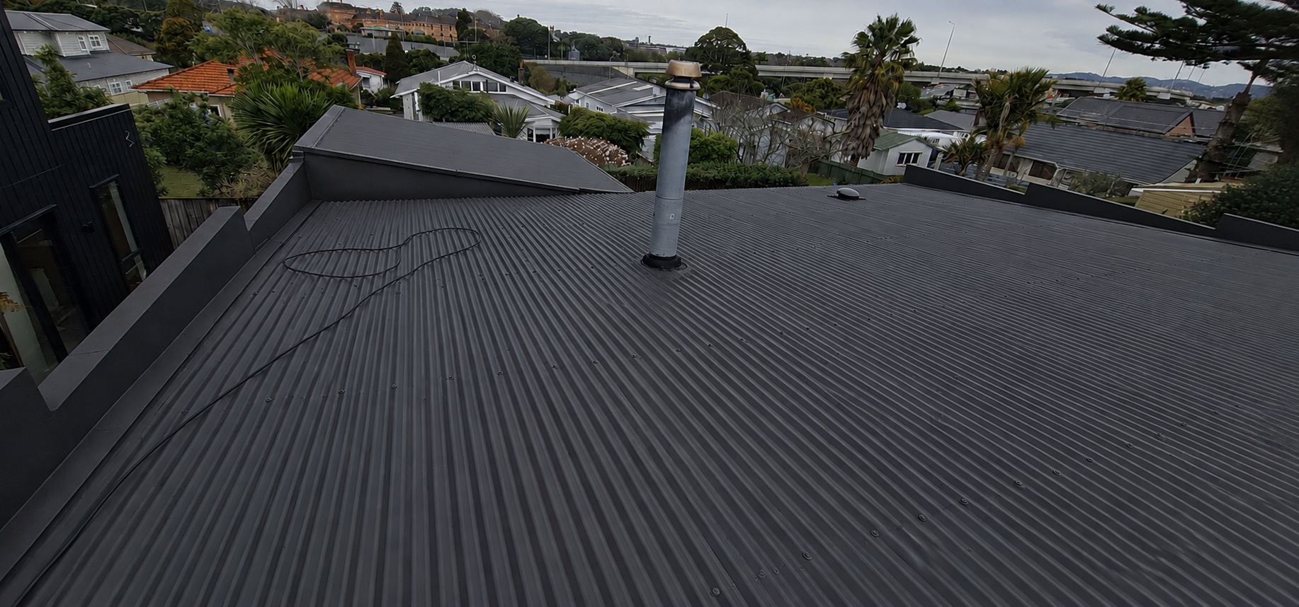 Completed metal roof painting and restoration project in Auckland