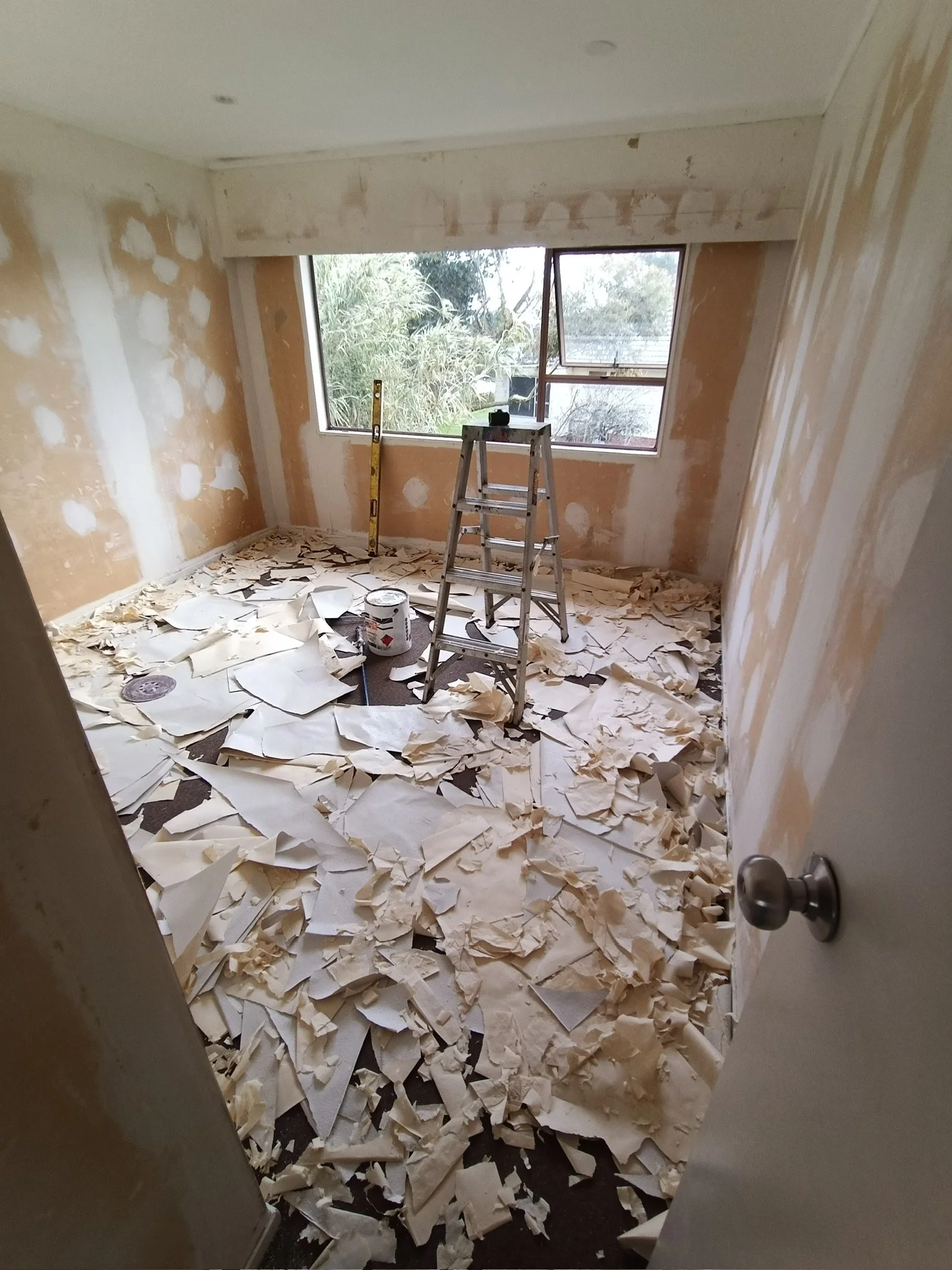 Preparing bedroom walls before interior painting in Mt Eden