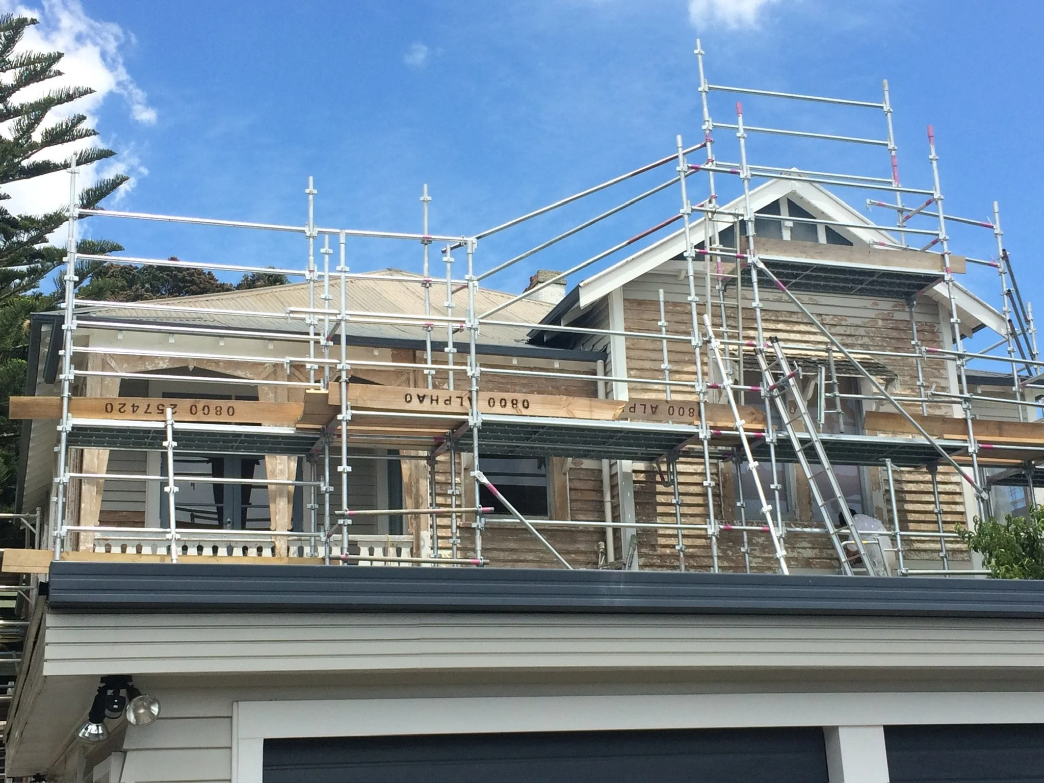 Weathered heritage weatherboards before restoration