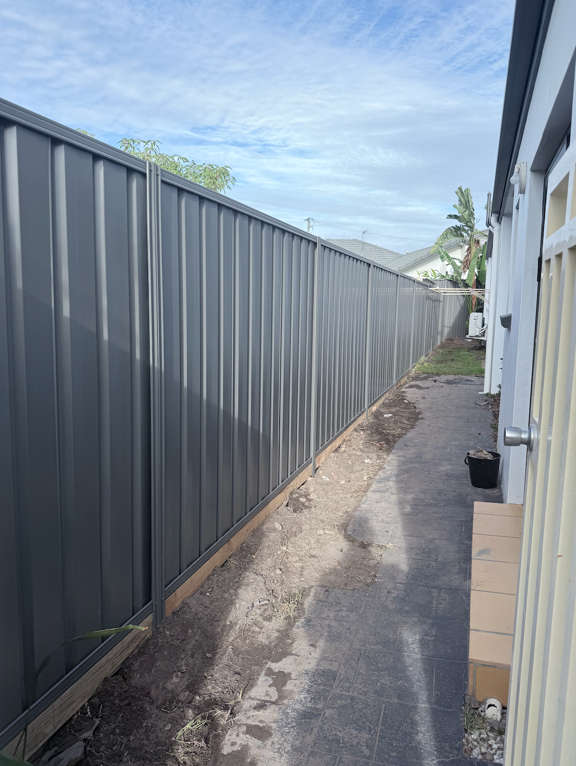 25-metre colorbond and sleeper fence completed in Miami