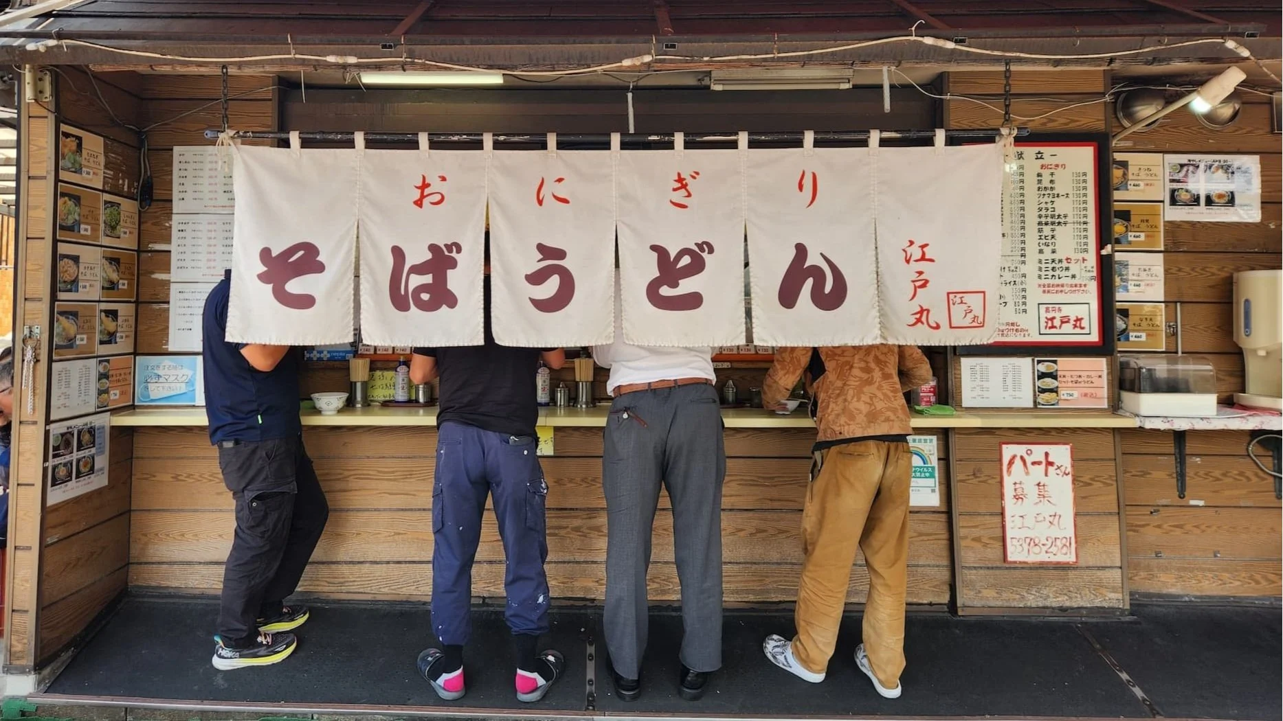 Truck drivers at standing noodle bar Koenji Tokyo