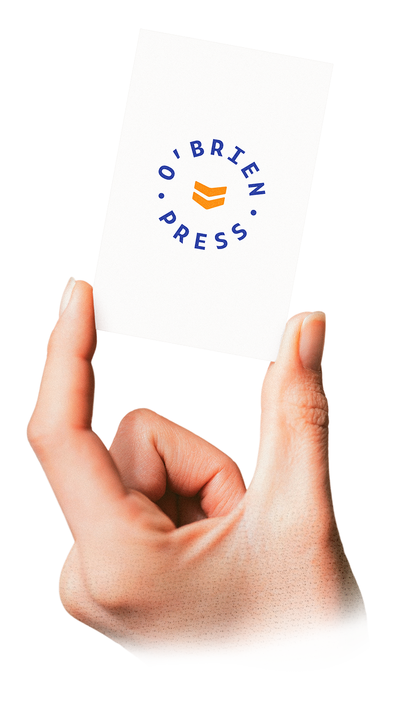 Close-up of a person's hand holding a business card with the logo and text 'O'Brien Press' on it.