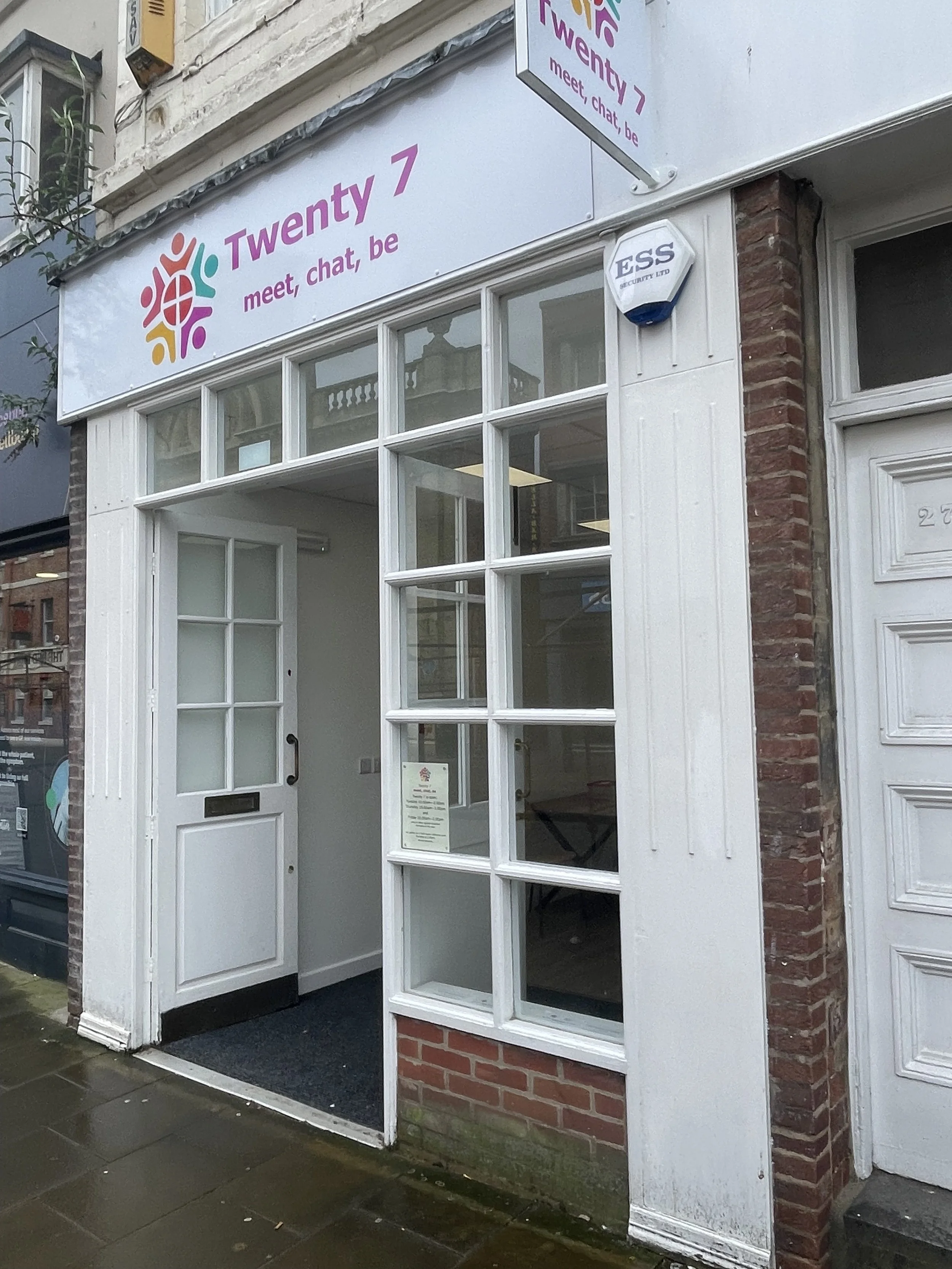 The entrance to the Twenty 7 site, with the words Twenty 7, meet, chat, be above the door.