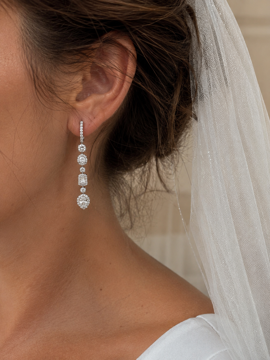 Bride wearing white gold diamond huggie earrings with detachable pear-shaped diamond drops. Lab-Grown bespoke bridal earrings designed for weddings, receptions, evening wear and everyday luxury jewellery.