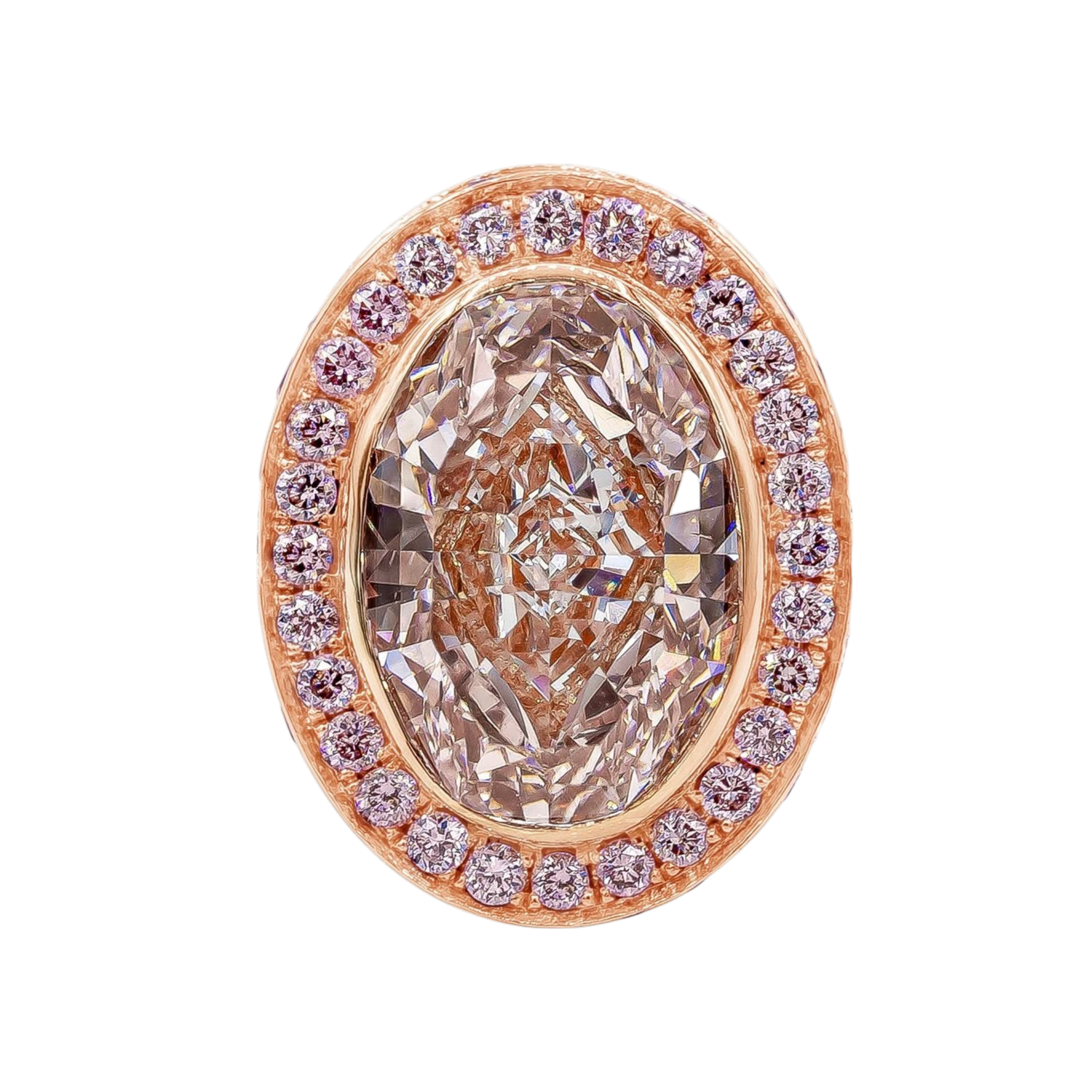 Rose gold engagement ring featuring a fancy pink oval diamond surrounded by a pink diamond halo with pavé shoulders. Bespoke coloured diamond engagement ring inspired by vintage designs.