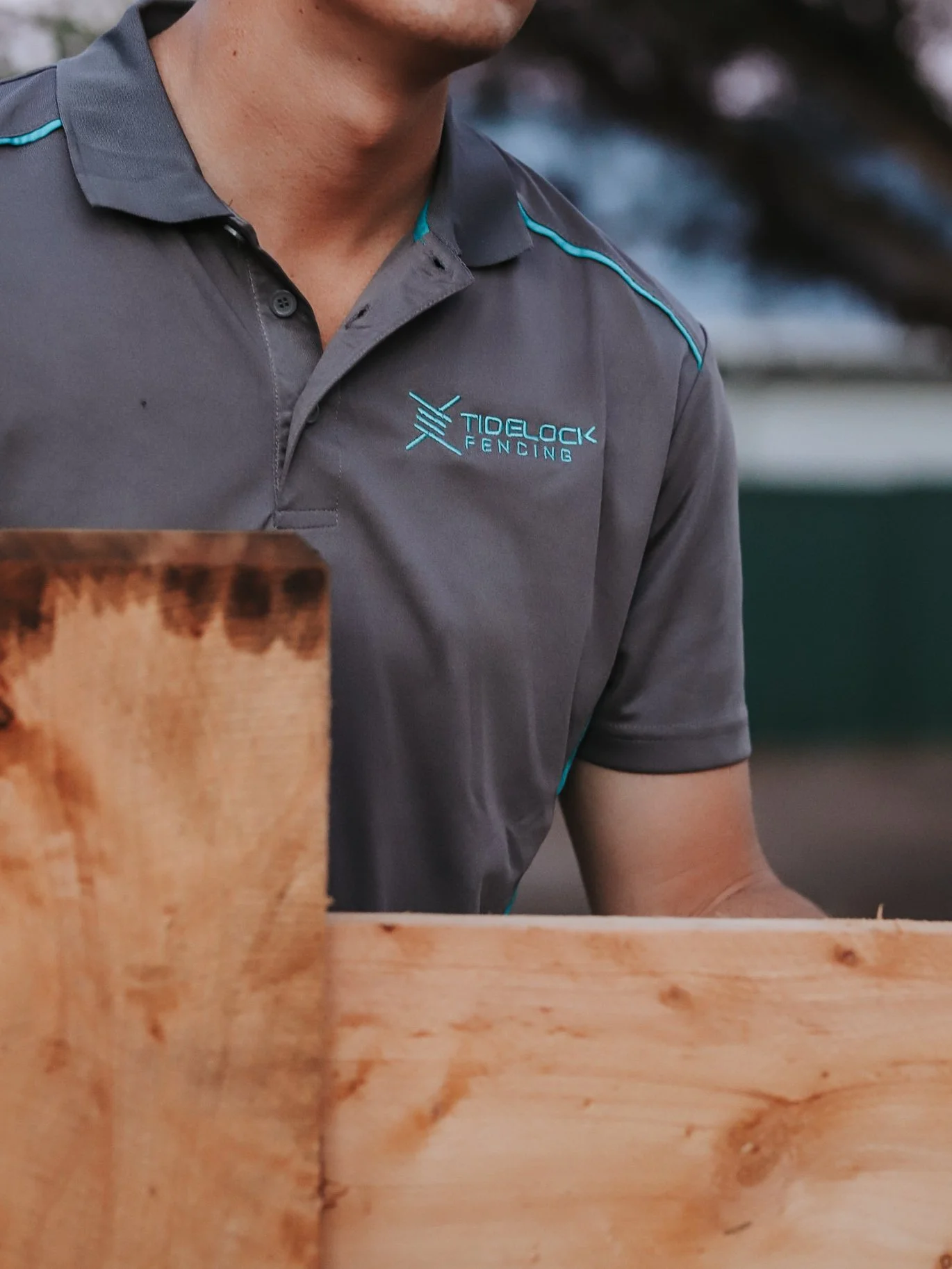Manwearingtidelockfencinggreypoloshirtfencemaintenancealbany.jpg
