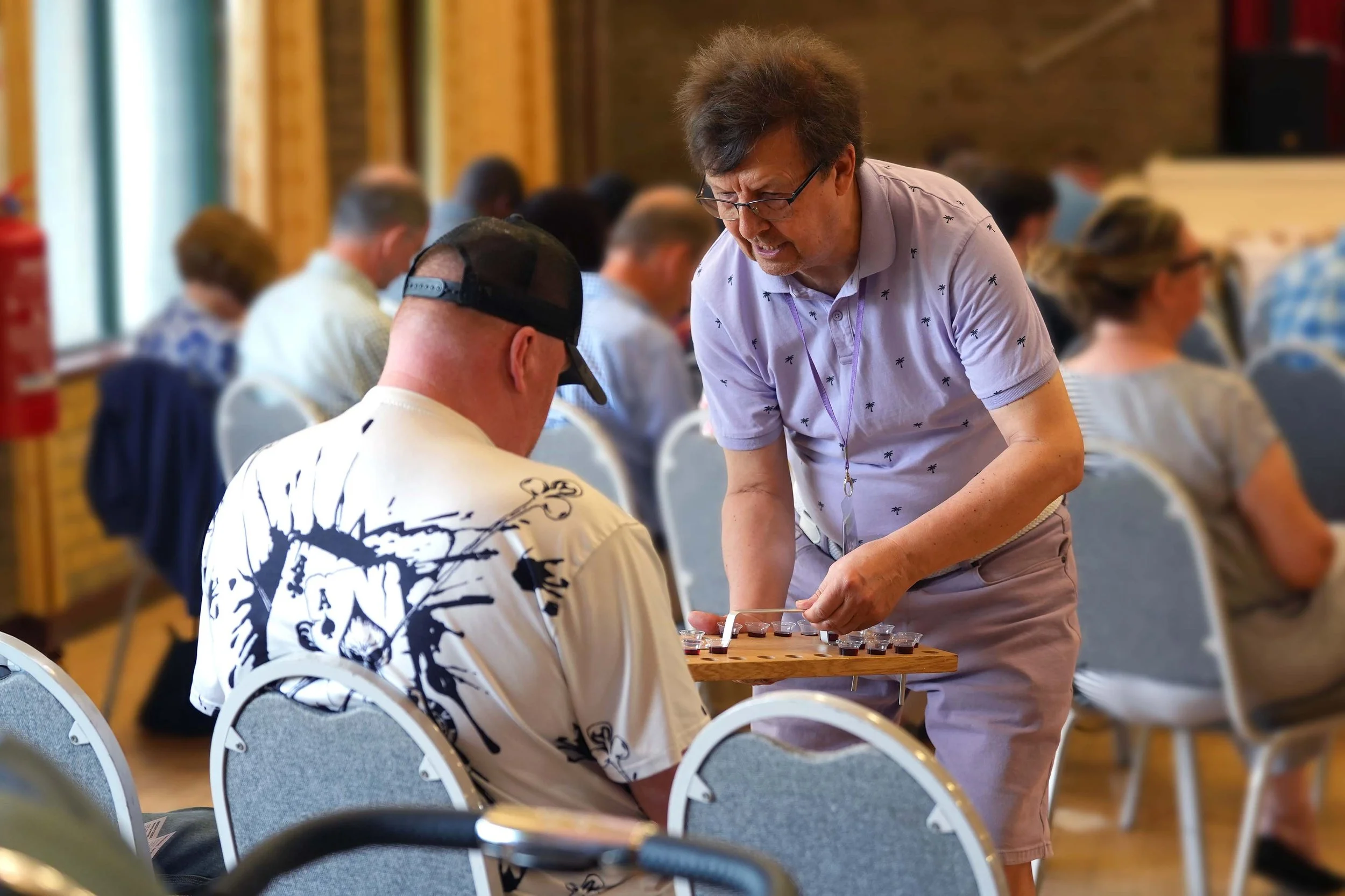 A man serves a church member Communion, or the Lords Supper, during a Sunday Service at Grace