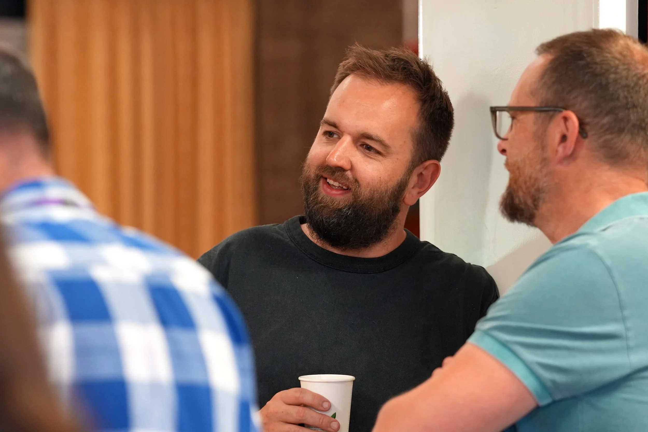 Smiling men engaging in conversation after one of our Sunday Services. #Grace #Church #SundayServices