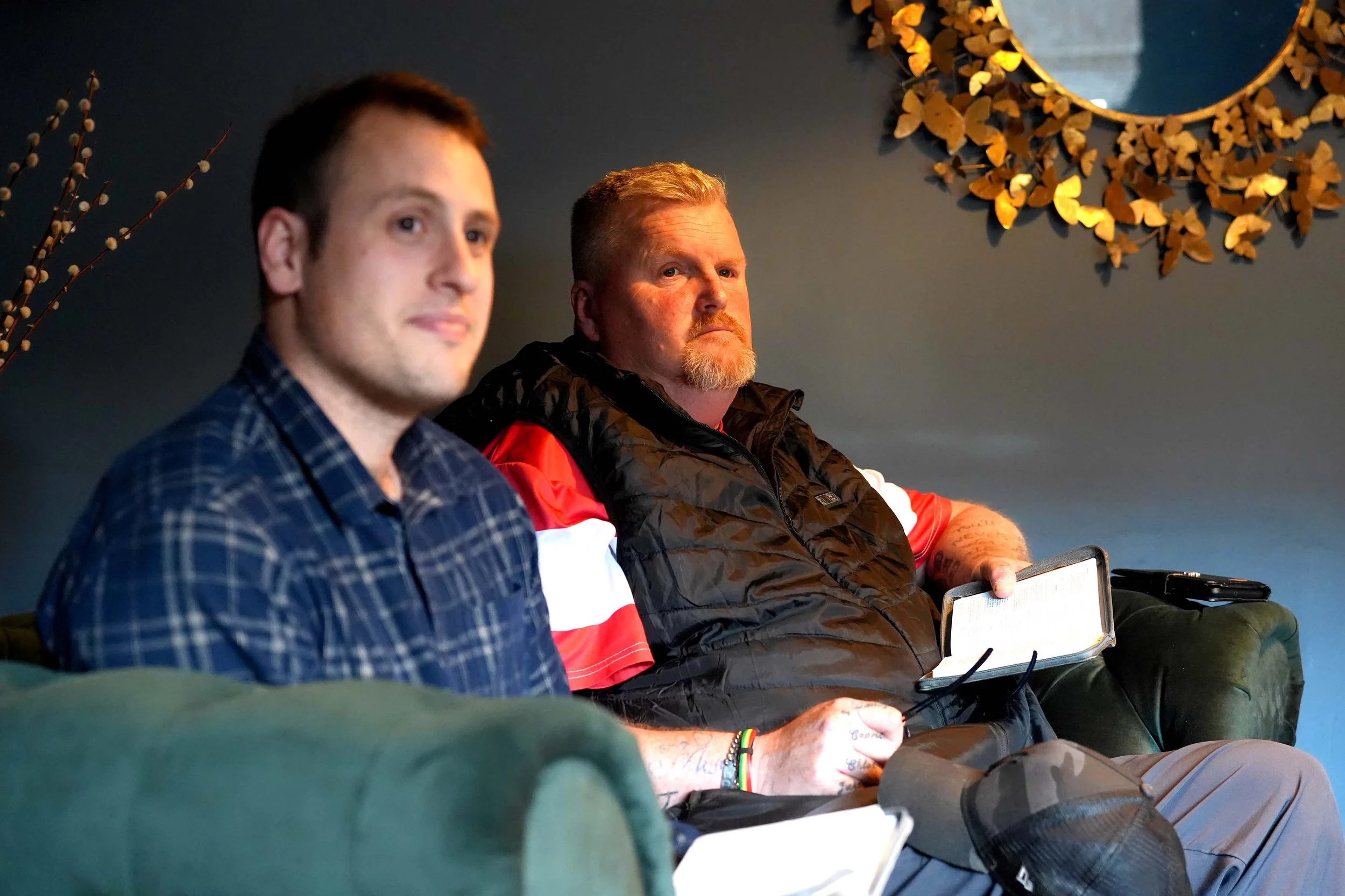 Two men sit and listen during one of the churches homegroups that run during the week.