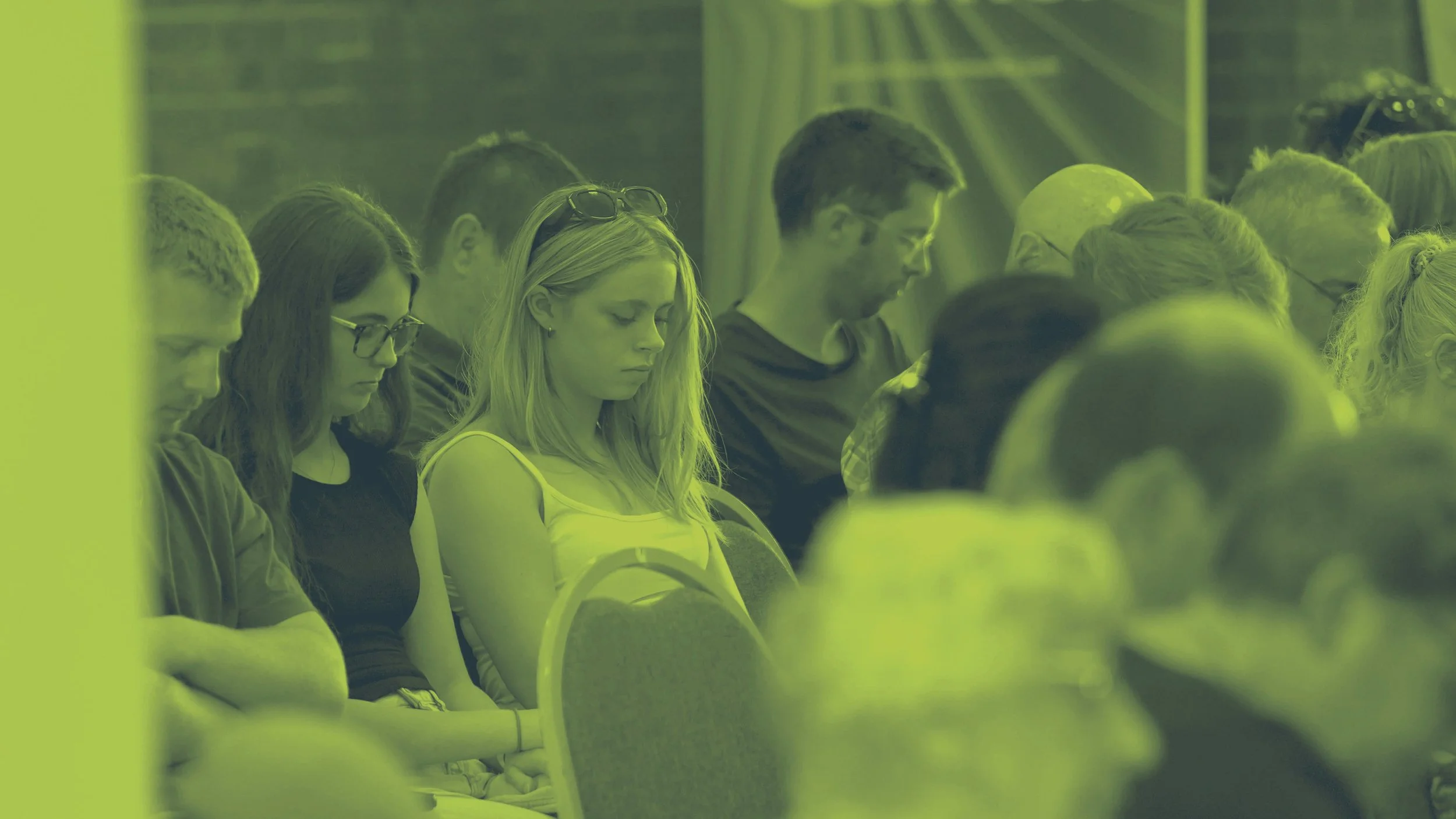 Group of people reading their Bibles during a Sunday Service at Grace Community Church. #Grace