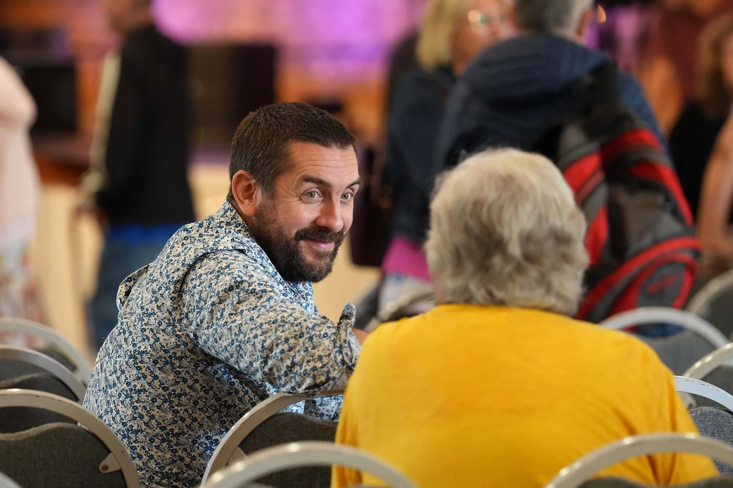 A pastor from Grace speaking to a woman after a Sunday Service at Grace. #Community #Church #Bedford