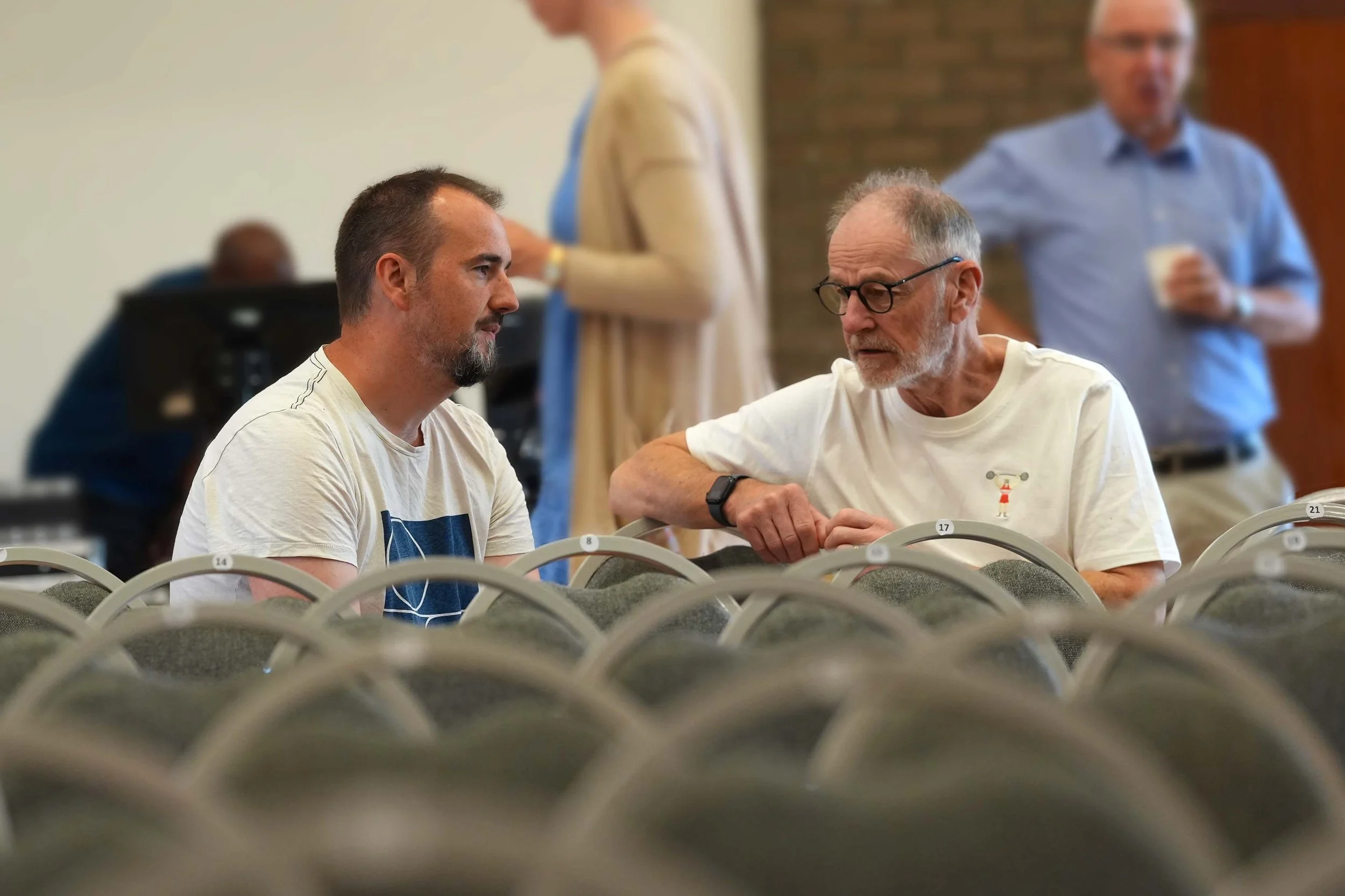 Two men are sitting in a room having a deep and meaningful conversation, supporting one another. #churchfamily