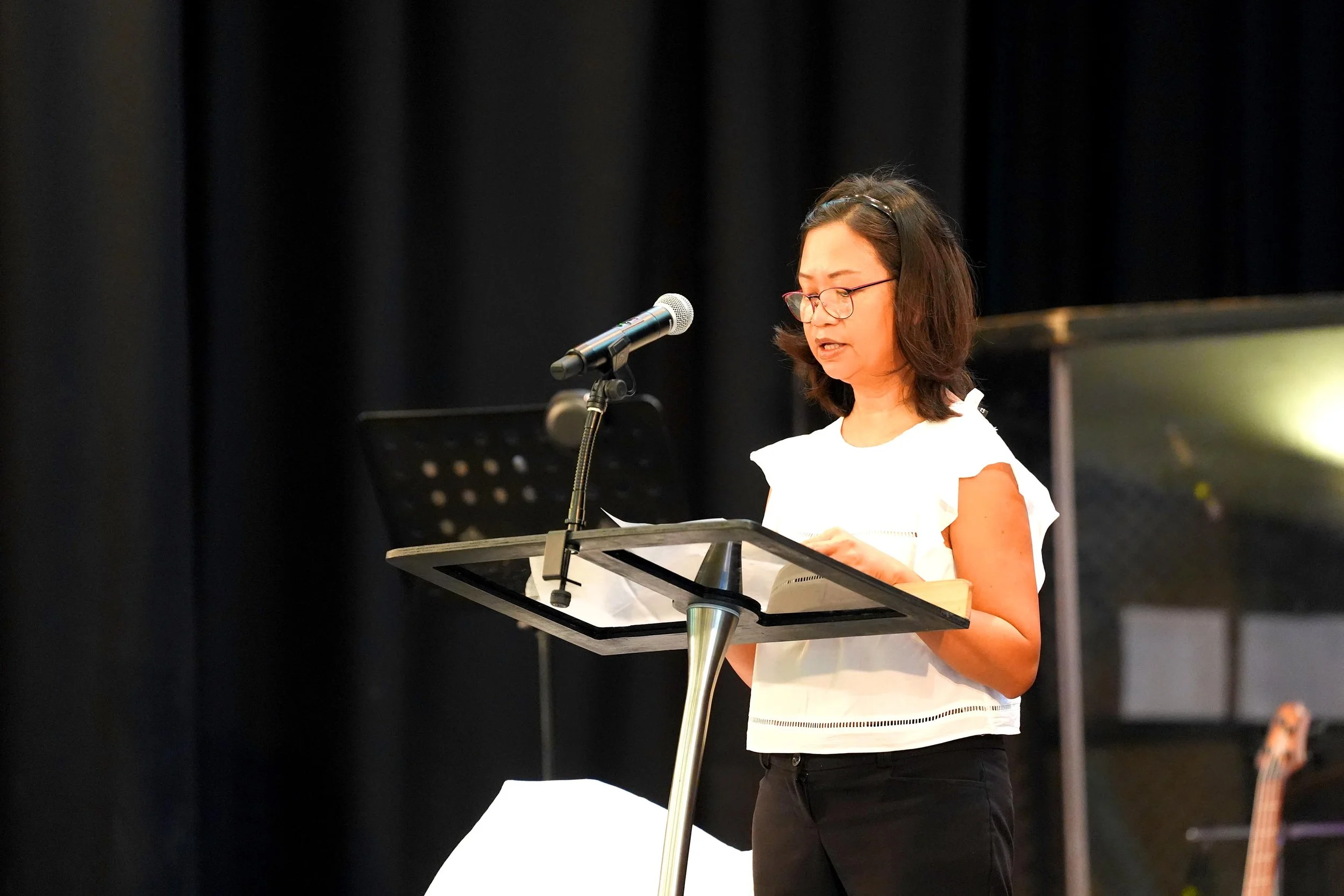 A women reads from the Bible during a Sunday Service at Grace Community Church, Bedford.
