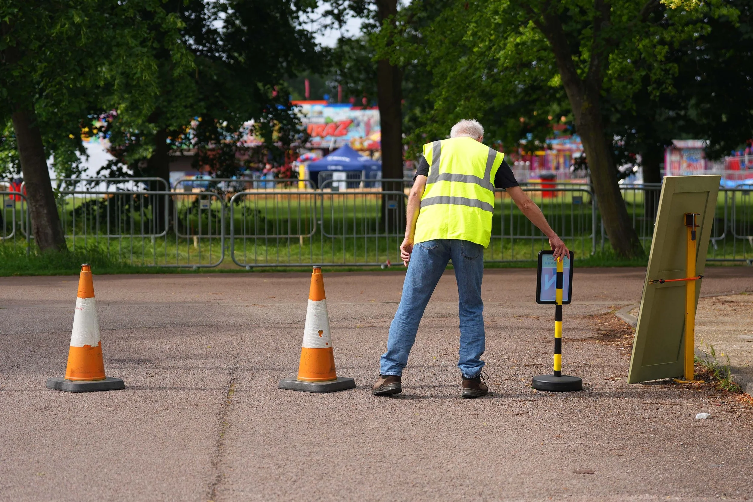 A volunteer helps with car parking at the Addison Centre during a Grace Sunday Service
