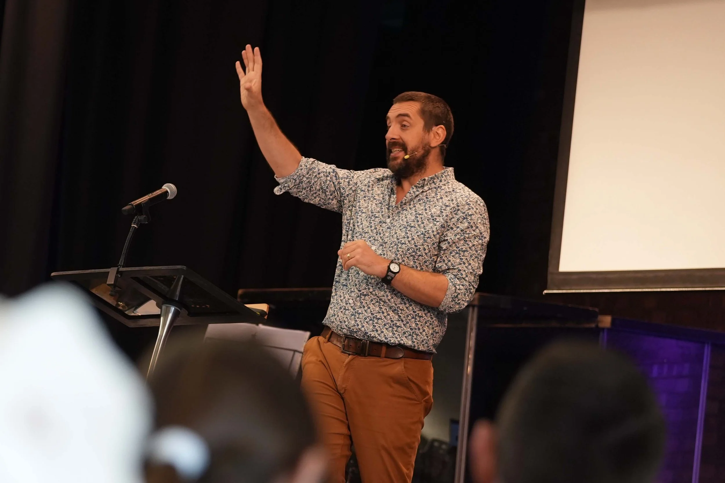 One of the pastors at Grace, preaching from the Bible